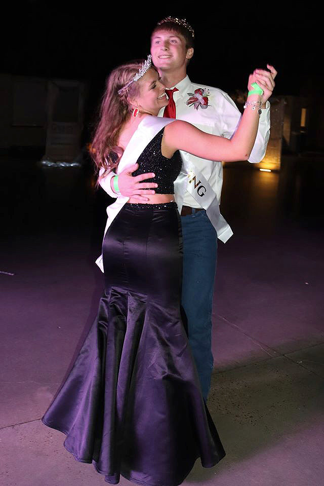 Prom Queen Kiley Allen and Prom King Heath Henke dance during prom Sunday.