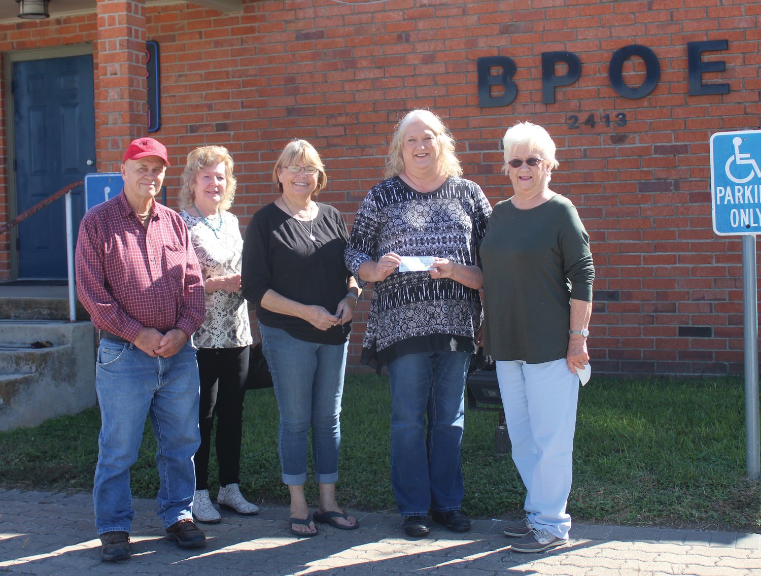 Presenting and representing First Shot Cookoff-Elks are Joe Kotwig, Mary Ann Day, Lori Behlen and Shirley Breitschopf. They are shown presenting a check to  Kari Breitschopf, director for the Gonzales County Senior Citizens in the amount of $1500.