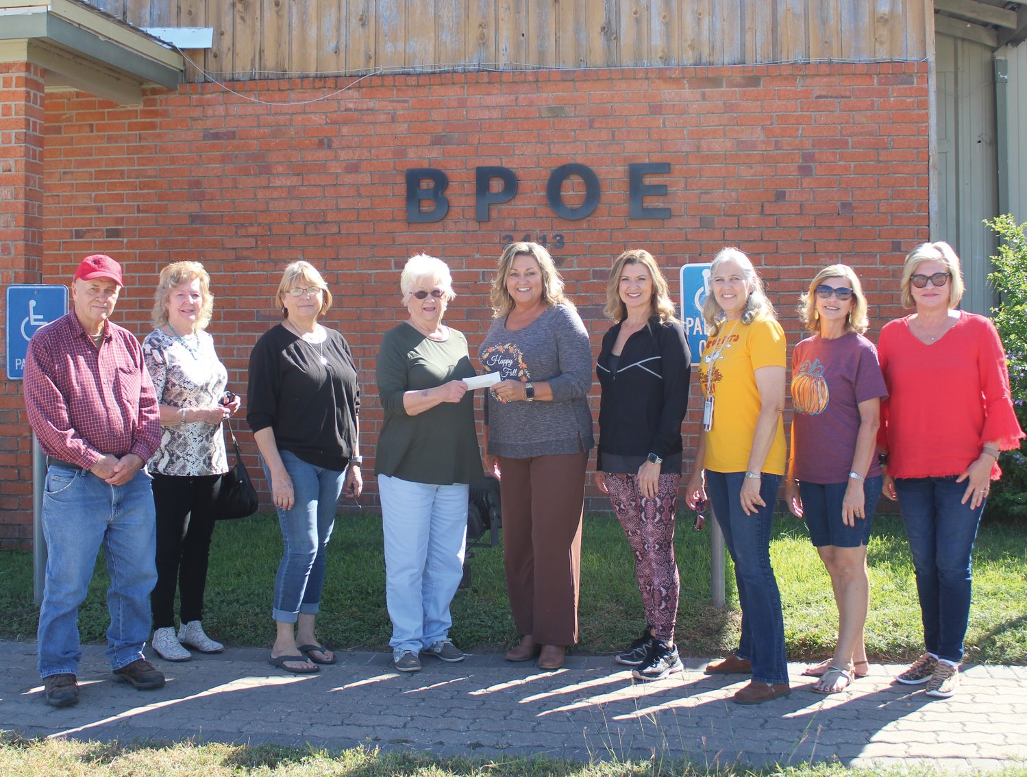 Joe Kotwig, Mary Ann Day, Lori Behlen and Shirley Breitschopf representing First Shot Cookoff-Elks are shown presenting a check for $1500 to go toward Foster Children’s Christmas Fund. Accepting check are Brenda Petru, Karen Fougerat, Noel Ince, Julie Bozcamp and Jean Burns.