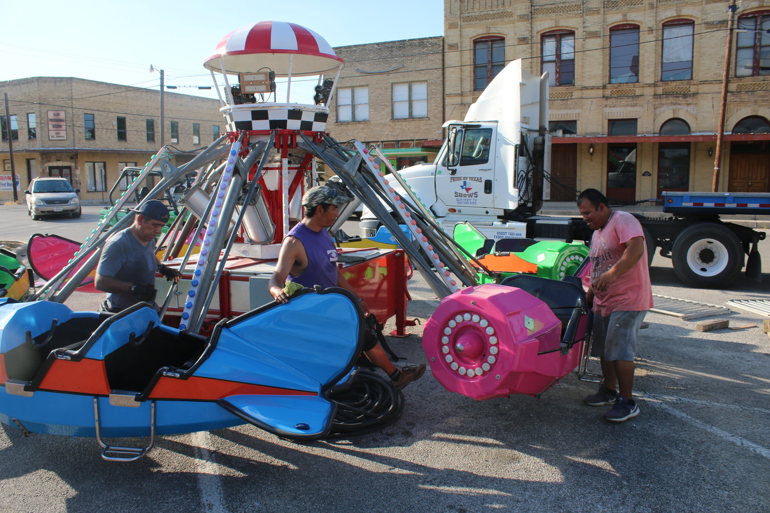 Workers with Pride of Texas Shows in Elm Mott set up the rides for the annual Come and Take It Celebration Carnival in Texas Heroes Square in downtown Gonzales on Tuesday, Sept. 28. The carnival is usually a big draw for the festival, which returns this week after not being held in 2020 due to the COVID-19 pandemic.