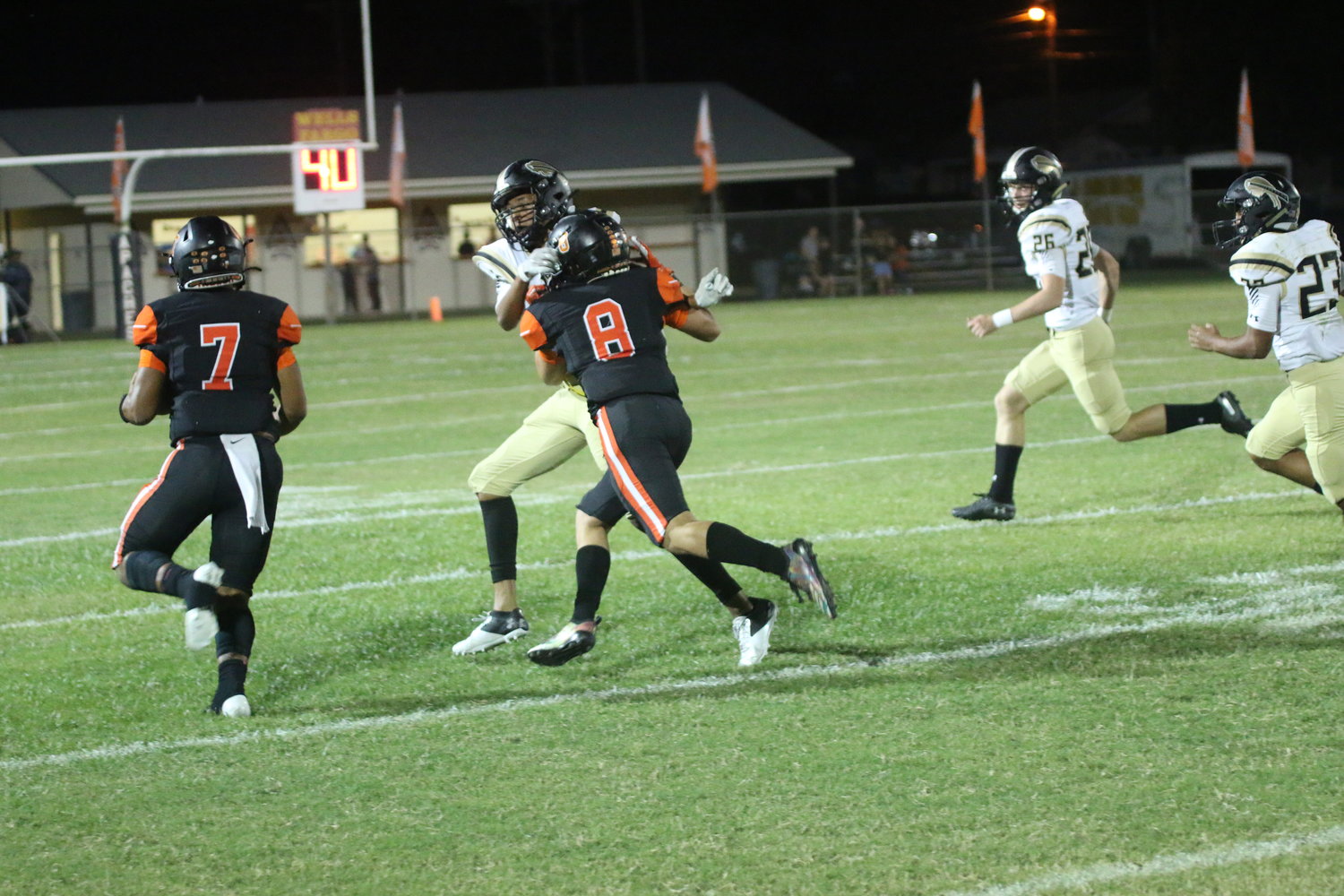 Quarterback Jarren Johnson (7) hits the outside on a keeper for 24 yards with blocking help from Carson Gaytan (8).