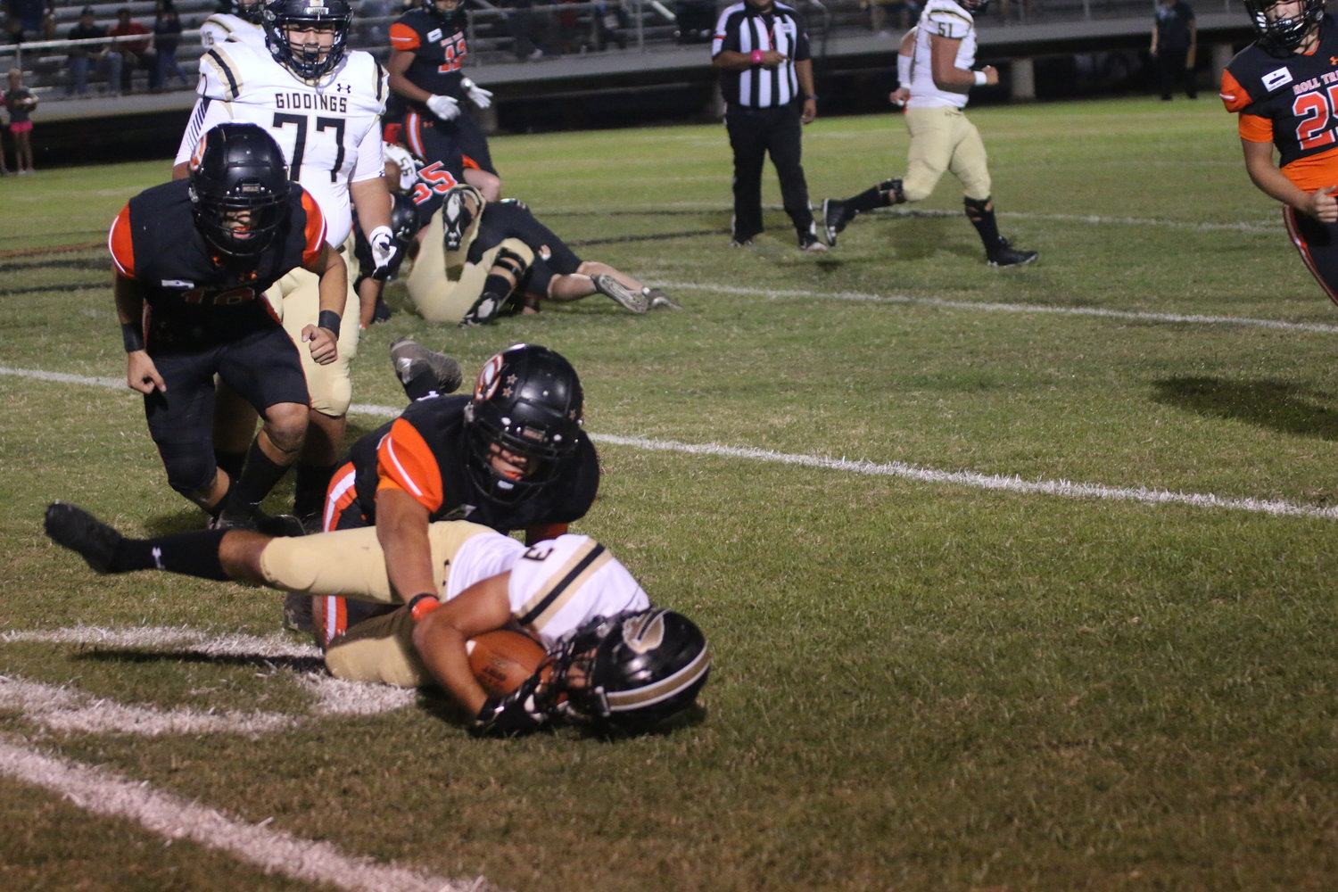 Blake Wright and T.J. Riojas combine to bring down a Giddings ballcarrier.