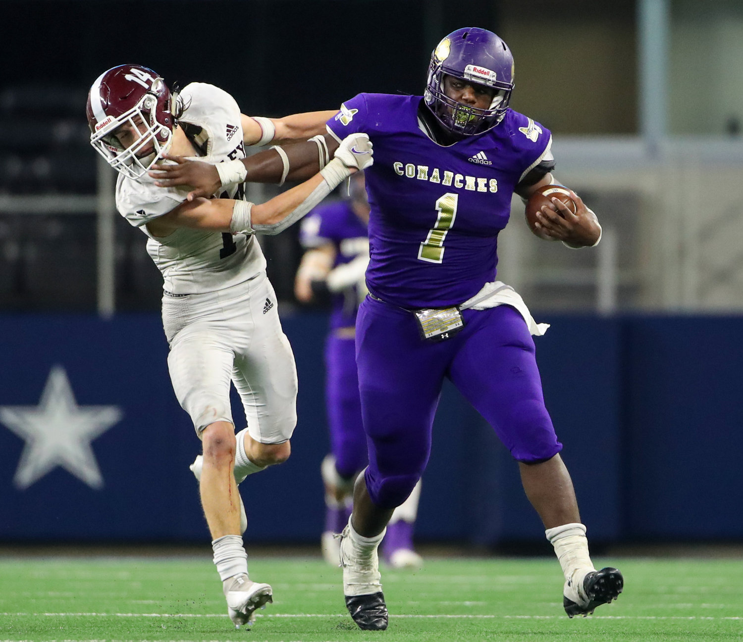 Shiner Comanches senior Doug Brooks (1) carries the ball on a 79-yard run during the fourth quarter of the Class 2A Division I state football championship game between Shiner and Hawley on December 15, 2021 in Arlington, Texas.