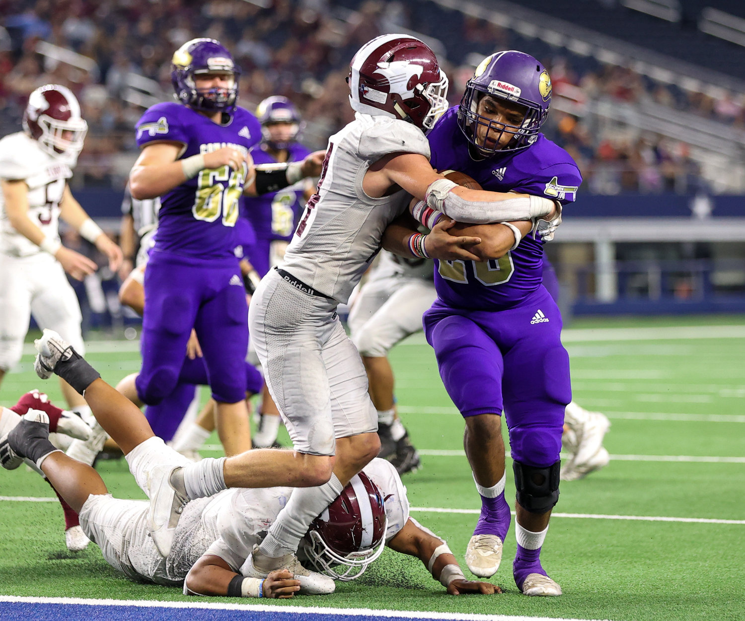 Shiner Comanches senior Makylin Burchell (28) carries the ball for a touchdown during the Class 2A Division I state football championship game between Shiner and Hawley on December 15, 2021 in Arlington, Texas.