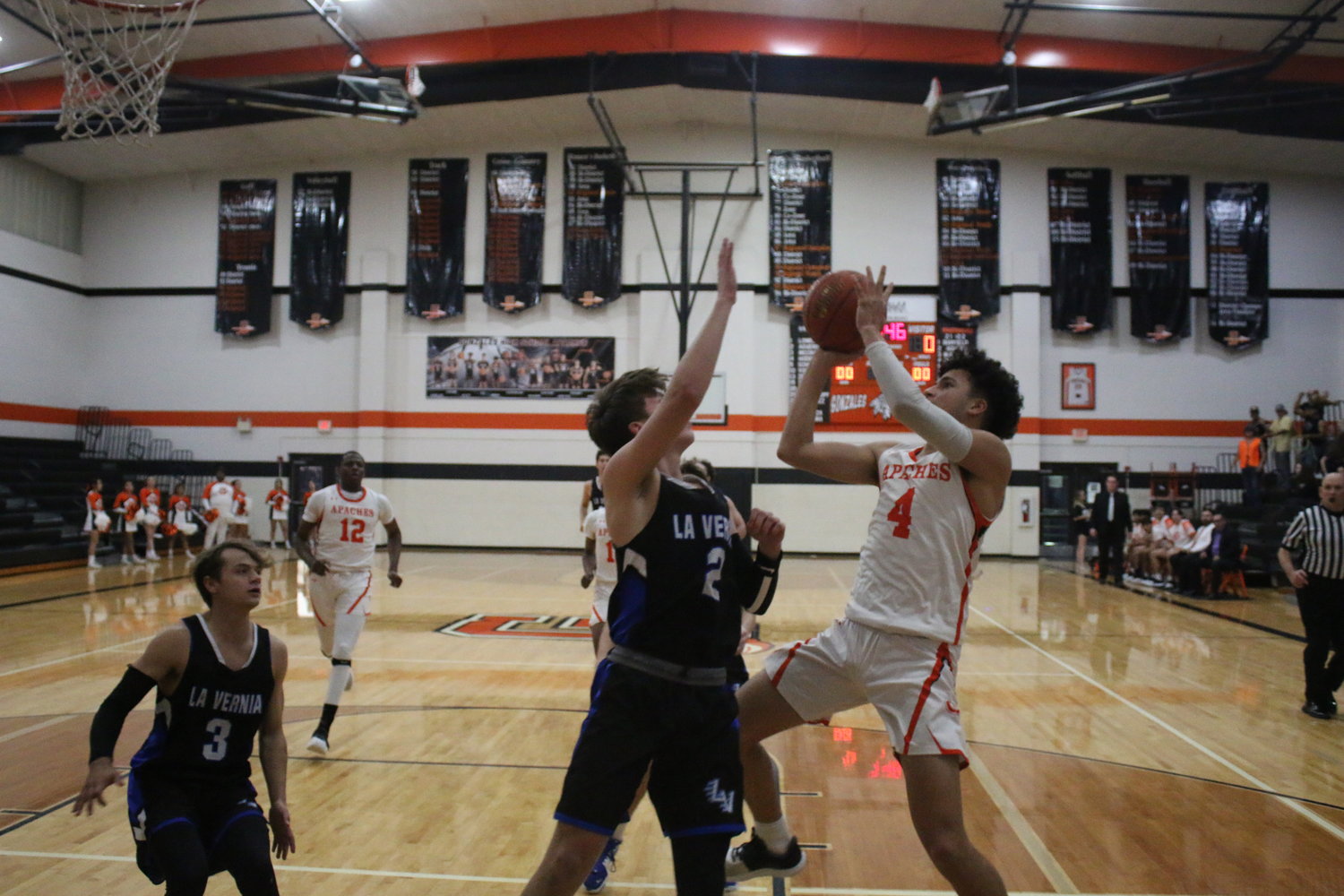 Angel Martinez goes up for a shot against La Vernia last week. Martinez scored 19 points against Navarro on Saturday as the Apaches won, 50-39.