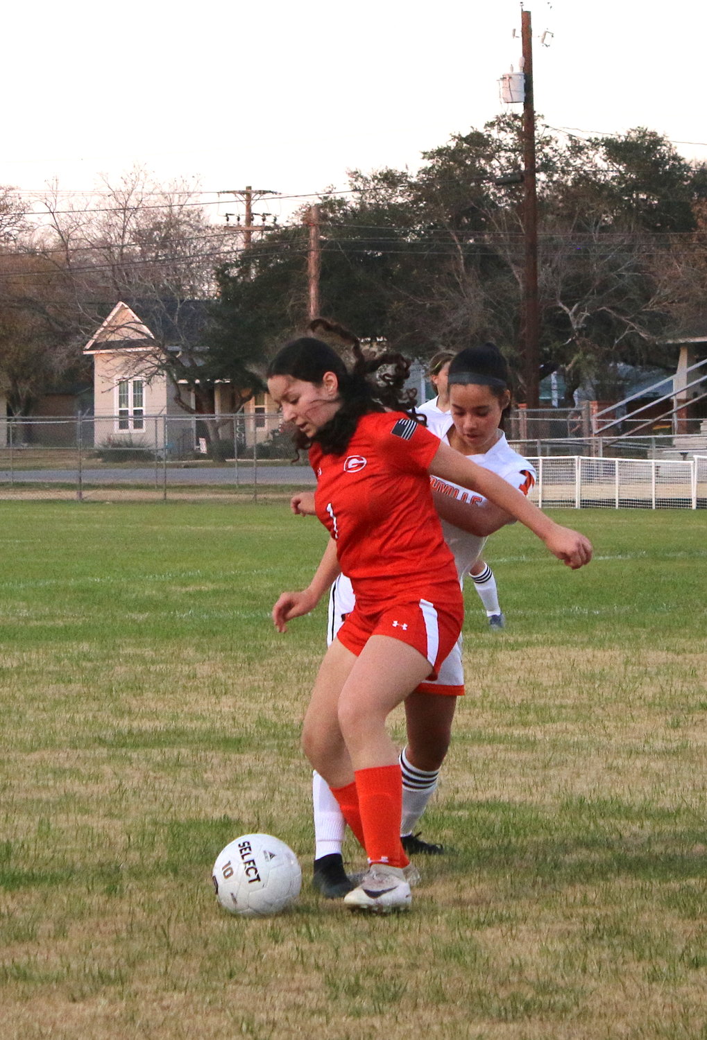 Gonzales Lady Apache Belen Leon (1) jostles for position during an earlier match this season. The Lady Apaches qualified for a playoff spot but details about that matchup were not available as of presstime.
