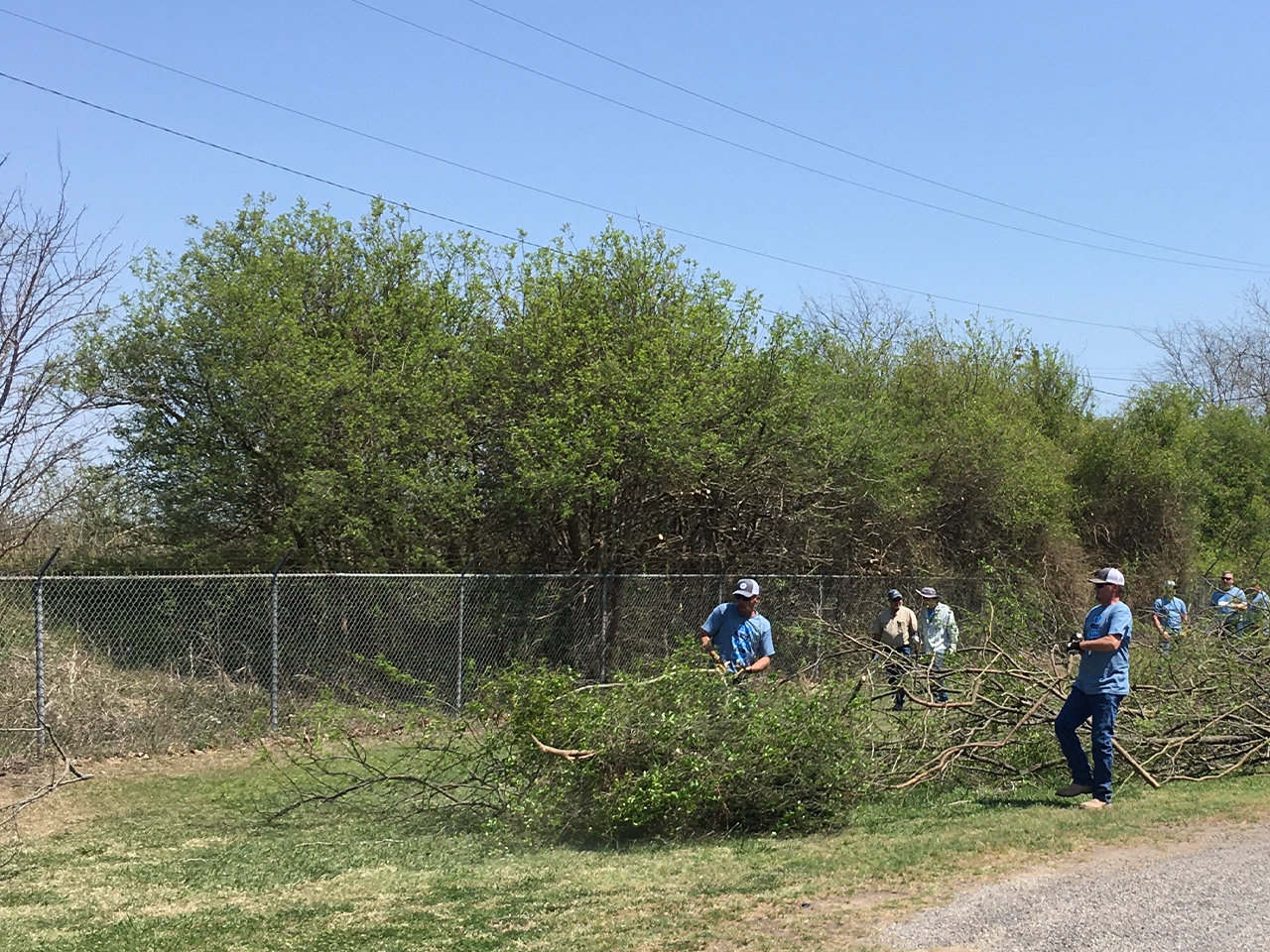 LCRA employees clear brush in Gonzales during LCRA’s Steps Forward Day on April 1. During the annual day of service, employees worked on more than 30 community projects throughout the LCRA service territory.