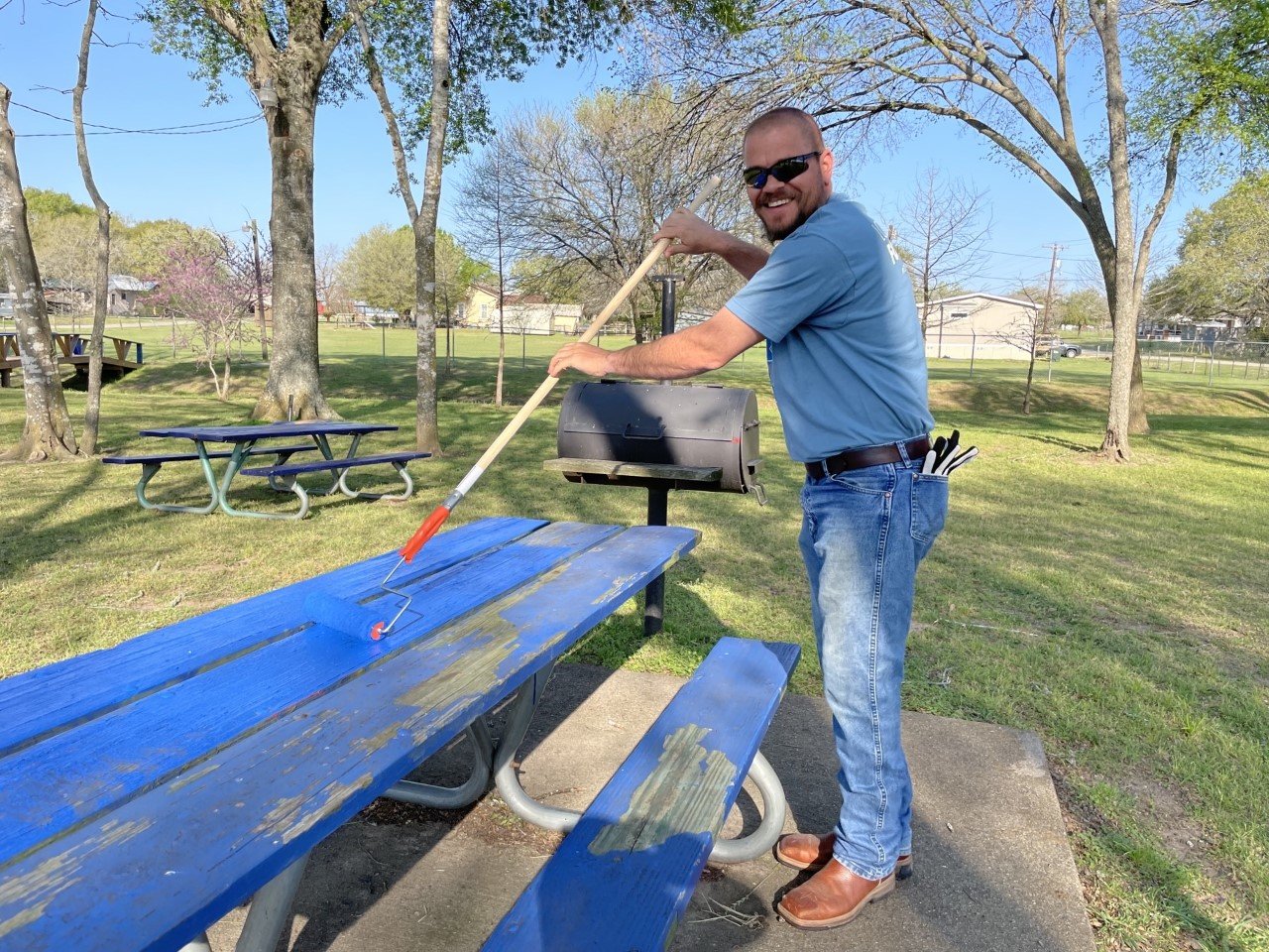 LCRA employee Matt Vinklarek paints a picnic table at the city park in Waelder during LCRA’s Steps Forward Day on April 1. During the annual day of service, employees worked on more than 30 community projects throughout the LCRA service territory.