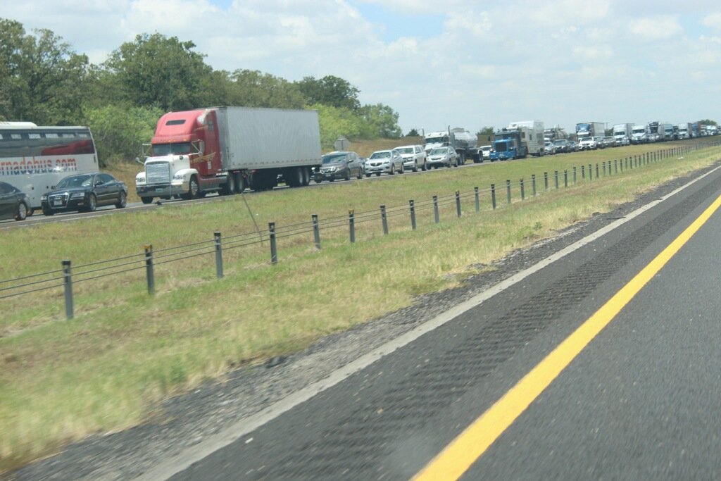 Traffic backs up on Interstate 10 eastbound in Gonzales County after a multiple fatality accident east of Waelder on Wednesday, July 6.