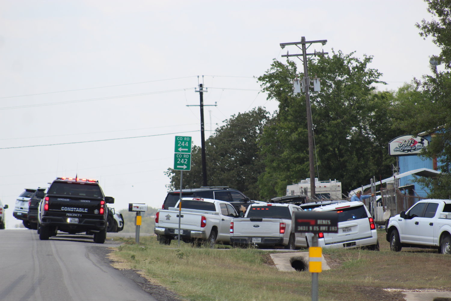 First responders in front of Jeff’s Auto Paint & More Wednesday afternoon on US 183 in response to a shooting at the business.