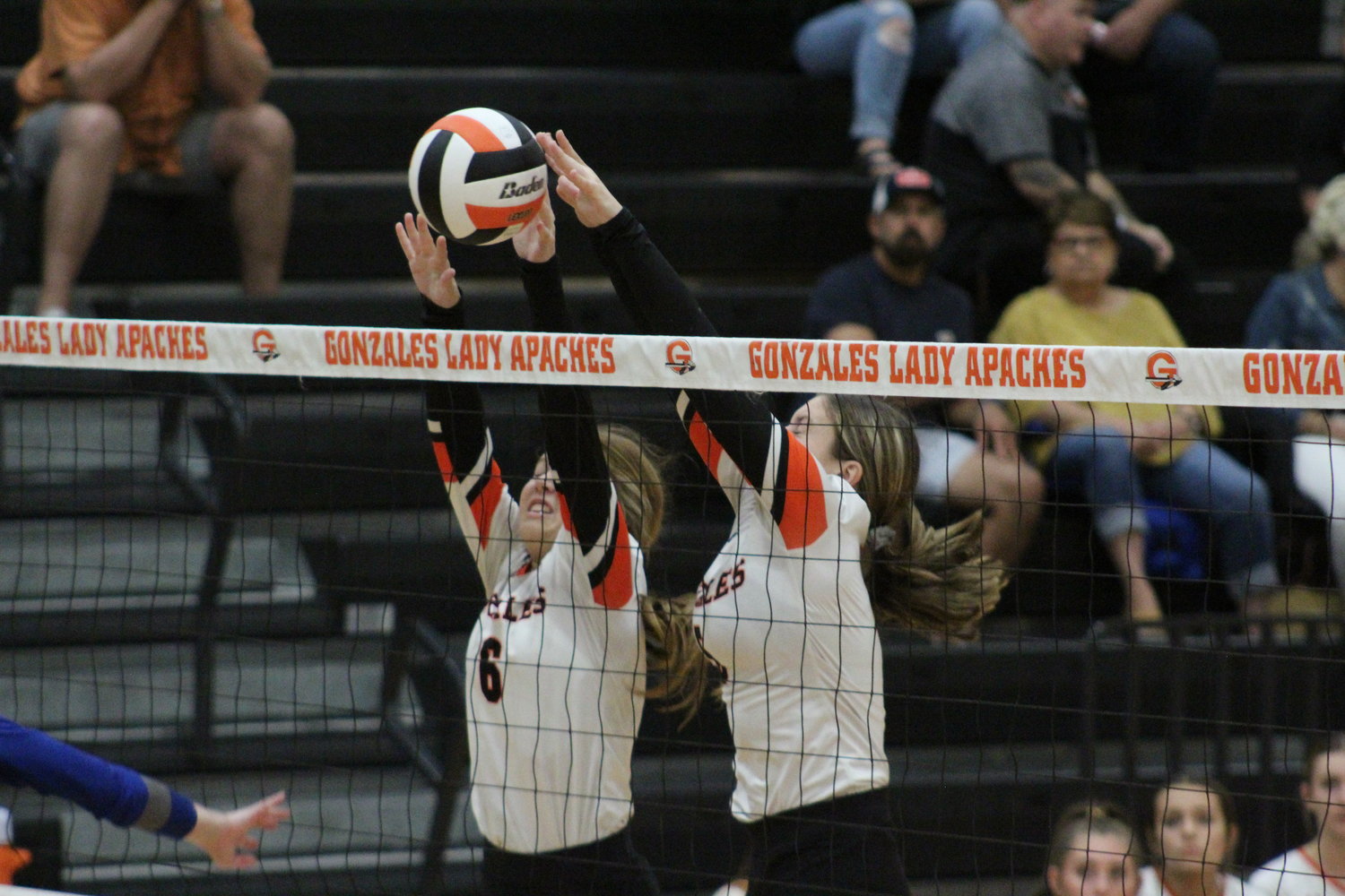 Gonzales Alyson Jahns (6) and Sydney McCray (5) blocks the ball in the air during the Lehman match Tuesday, Aug. 23.