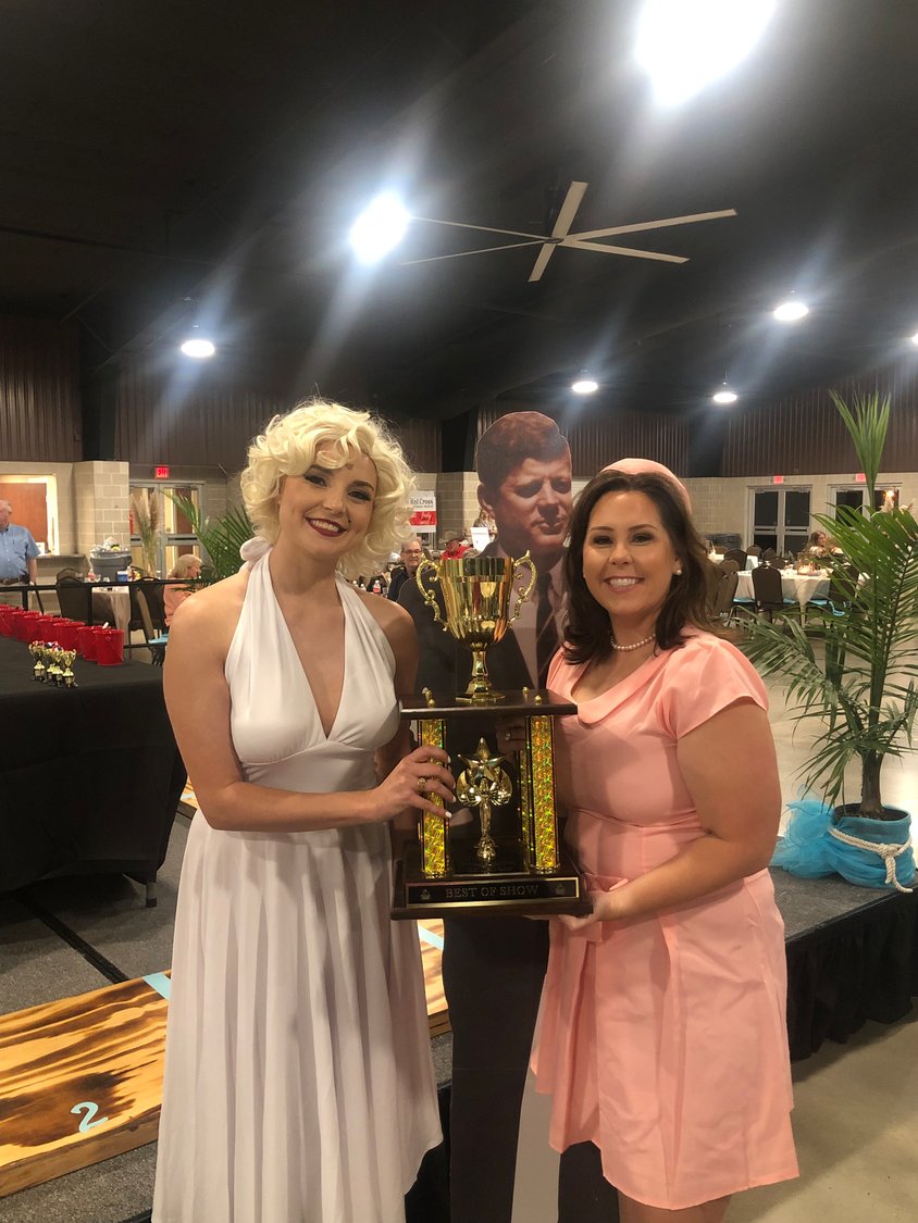 Marilyn Monroe (Daisy Scheske Freeman), left, and Jackie Kennedy (Britney Jones Caka), better known as “Kennedy’s Kissers,” win the Best of Show during the 5F Gala at JB Wells Expo Center.