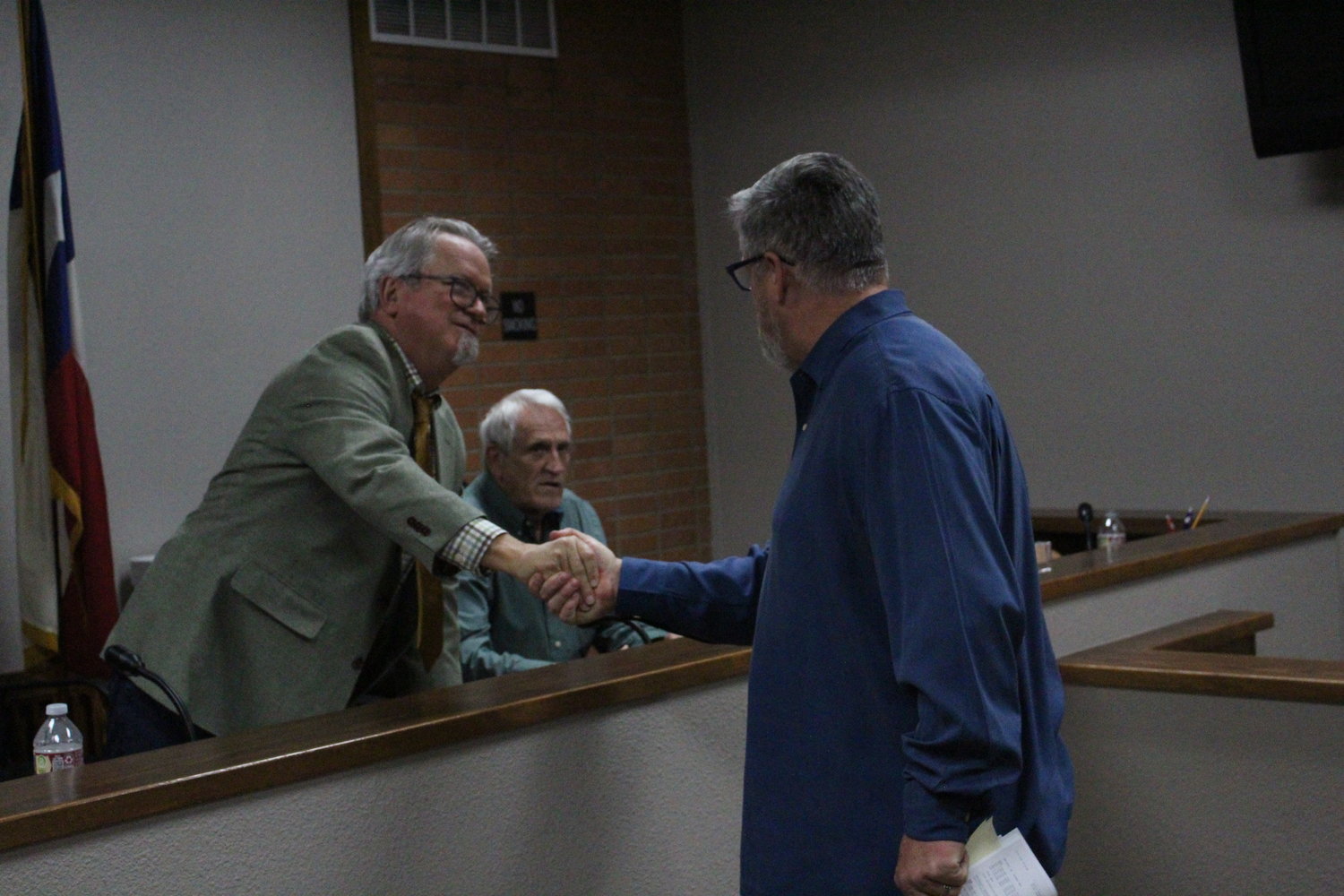 Mayor Steve Sucher congratulates Tim Crow on being appointed Gonzales city manager full time.
