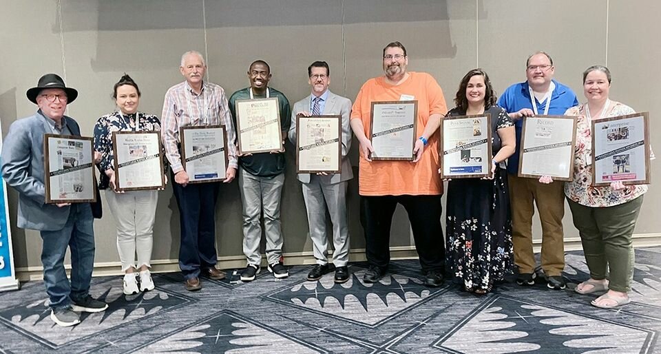 2022 Texas Better Newspaper contest sweepstakes winners are (from left) Victoria Advocate in Division 2, Keith Kohn; Uvalde Leader-News in Division 3, Meghann Garcia; The Nacogdoches Sentinel, in Division 4, Rick Craig; Taylor Press in Division 5, Jason Hennington; Fredericksburg Standard Radio Post in Division 6, Ken Cooke; Gonzales Inquirer in Division 7, Lew Cohn; Pilot Point Post Signal in Division 8, Abigail Allen; and Vernon Daily Record in Division 9, Daniel and Elinor Walker. The Walkers are also displaying the Division 10 sweepstakes for the Clarendon Enterprise. The awards were presented at the closing event of the 2023 Texas Press Association Convention and Trade Show in Round Rock.