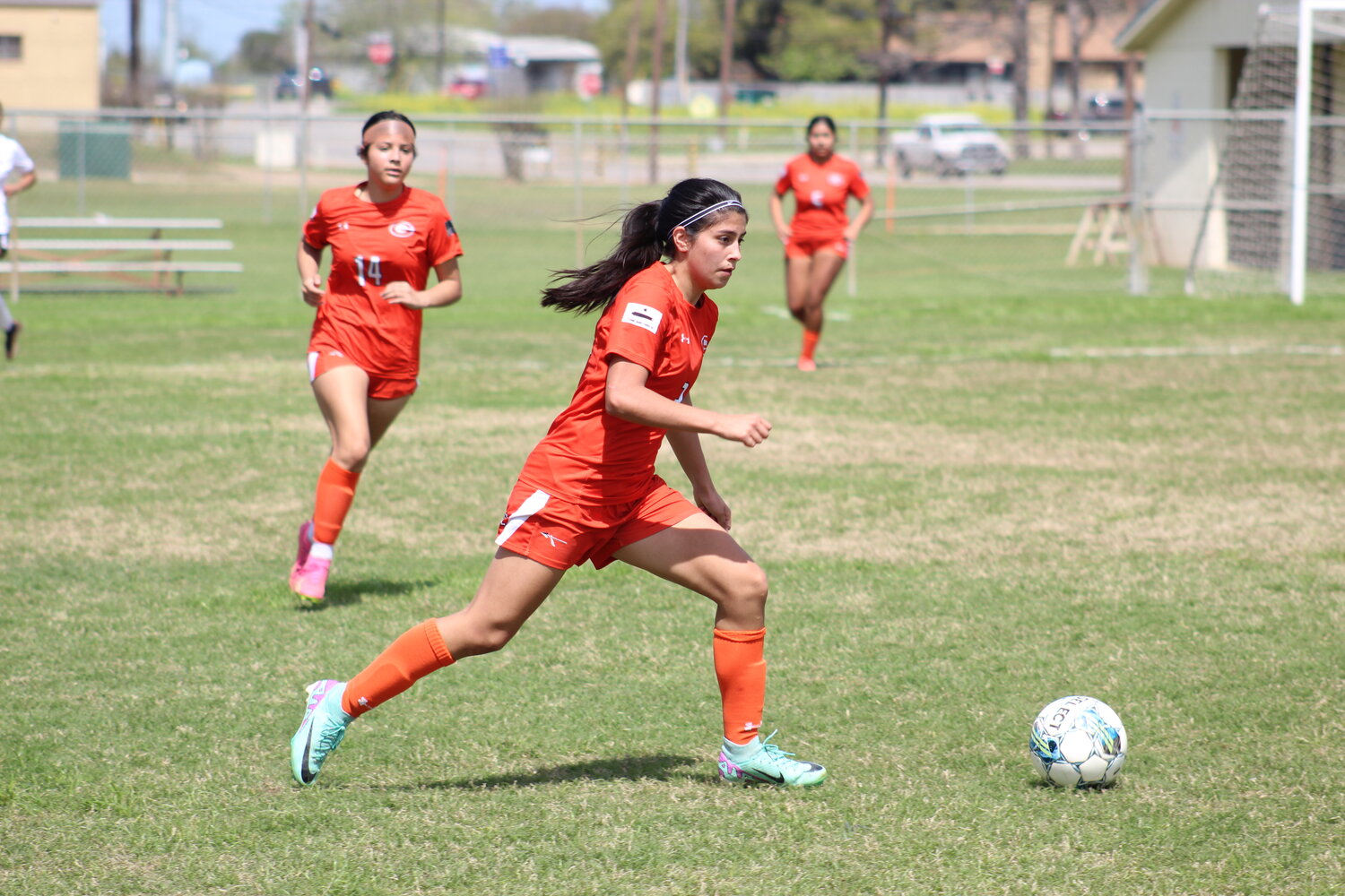 Lady Apaches junior Bella Aguero (2) moves the ball down field in 
the final home game against the YWLA Lady Cardinals Monday, 
March 11.