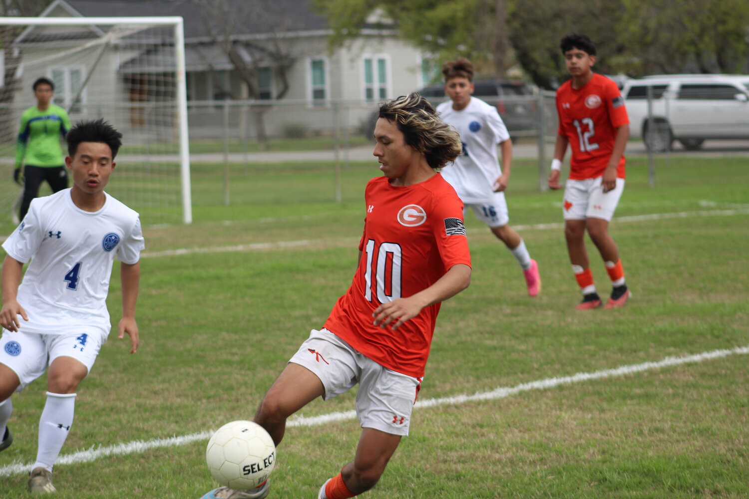 Senior Marcos Vazquez (10) kicks the soccer ball on the offense for the Apaches in the final match of the season against Memorial Tuesday, March 12.