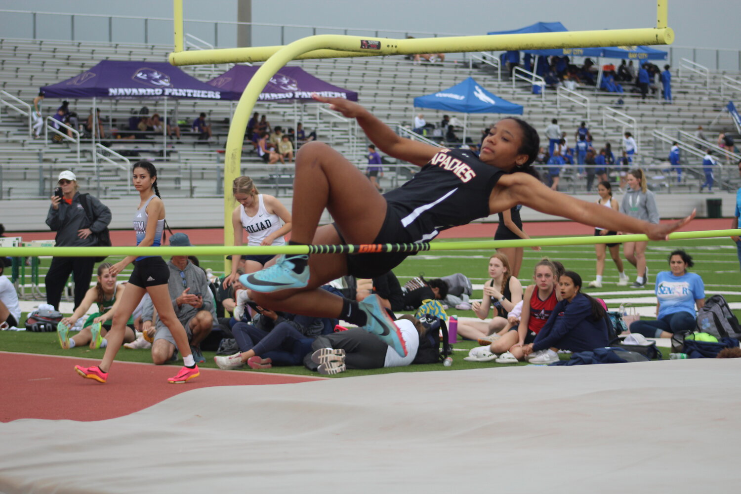 Lady Apaches’ Malaiyah Mayo competes in the high jump competition of the Cuero track meet Thursday, March 7.