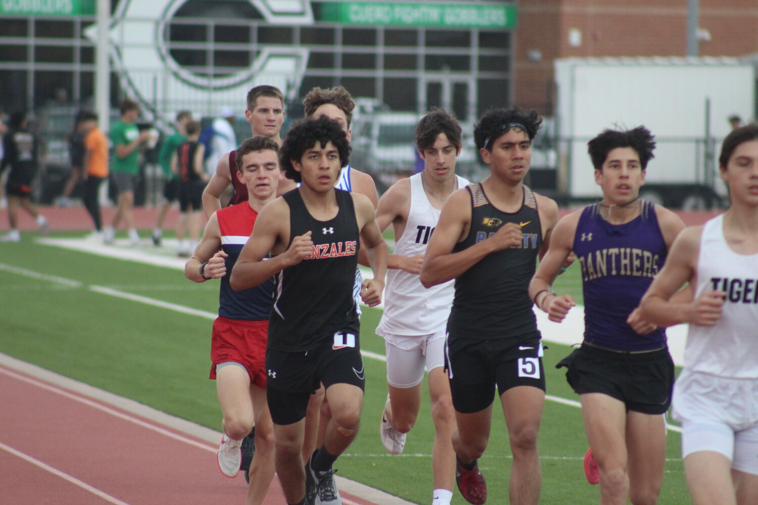 Apaches’ Ckristofer Ramos runs in the 1600m race at the Cuero track meet Thursday, March 7.
