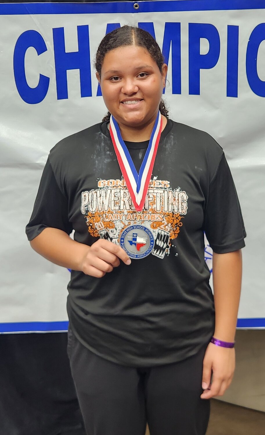 Madison Sampleton holds her state runner up medal for the 220-pound division at the THSWPA state powerlifting meet in Frisco Friday, March 15. Sampleton completed her powerlifting season at 1070 total pounds in her weight division.