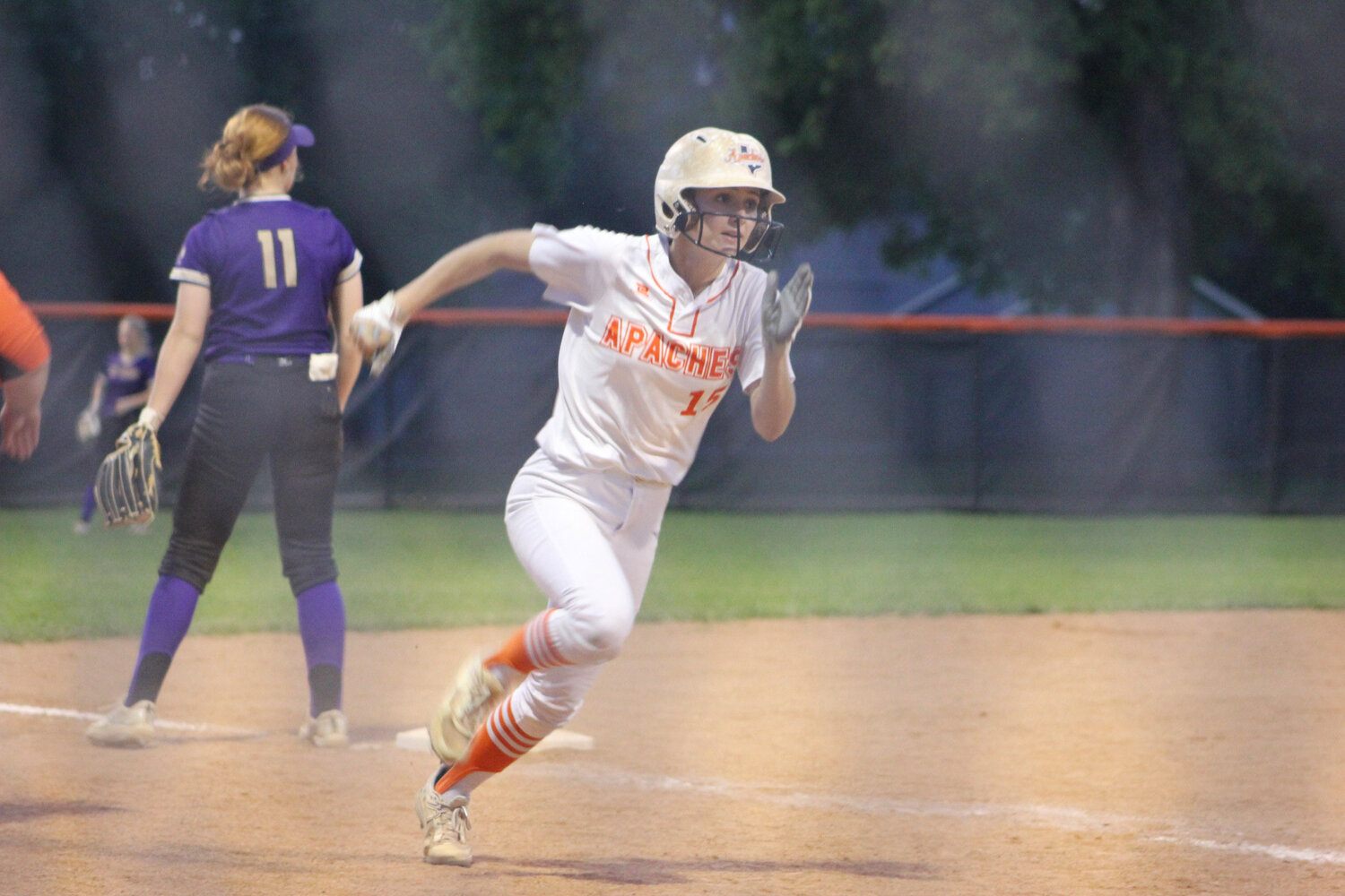 Lady Apaches senior Dakota Schmidt (15) runs for home plate for the score in the district match against Navarro Tuesday, April 9.