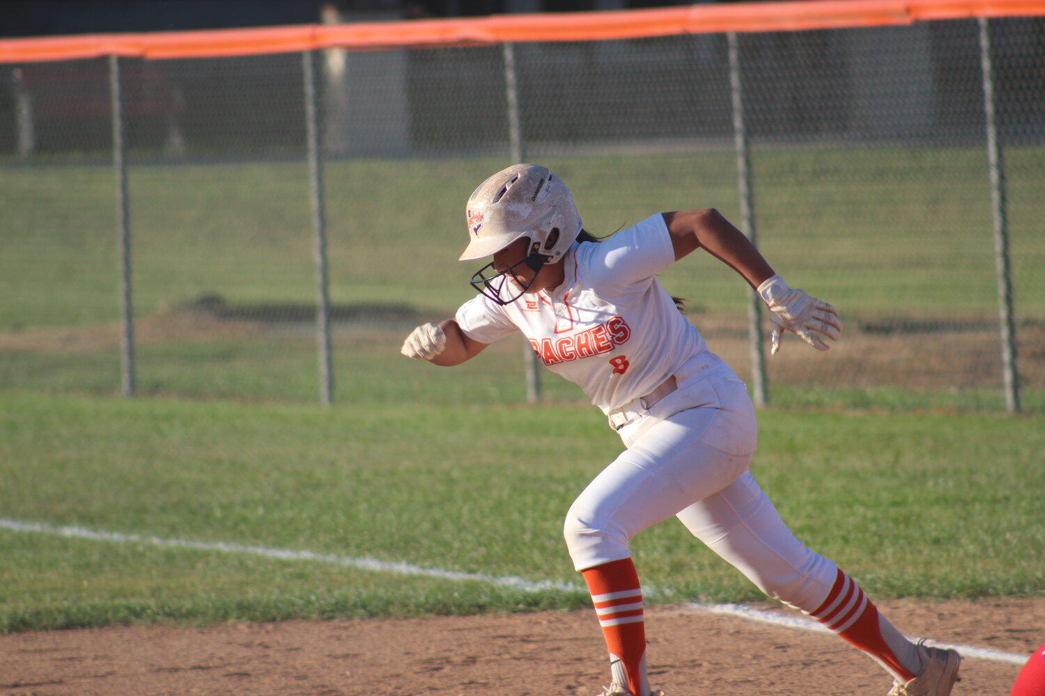 Lady Apaches freshman first basemen Alexzis Hernandez (8) runs towards second base for a steal in the district match against Memorial.