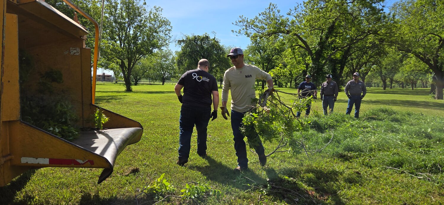 LCRA employees clean up brush at Independence Park in Gonzales during LCRA’s Steps Forward Day on April 12. During the annual day of service, employees worked on 36 community projects throughout LCRA’s service territory.