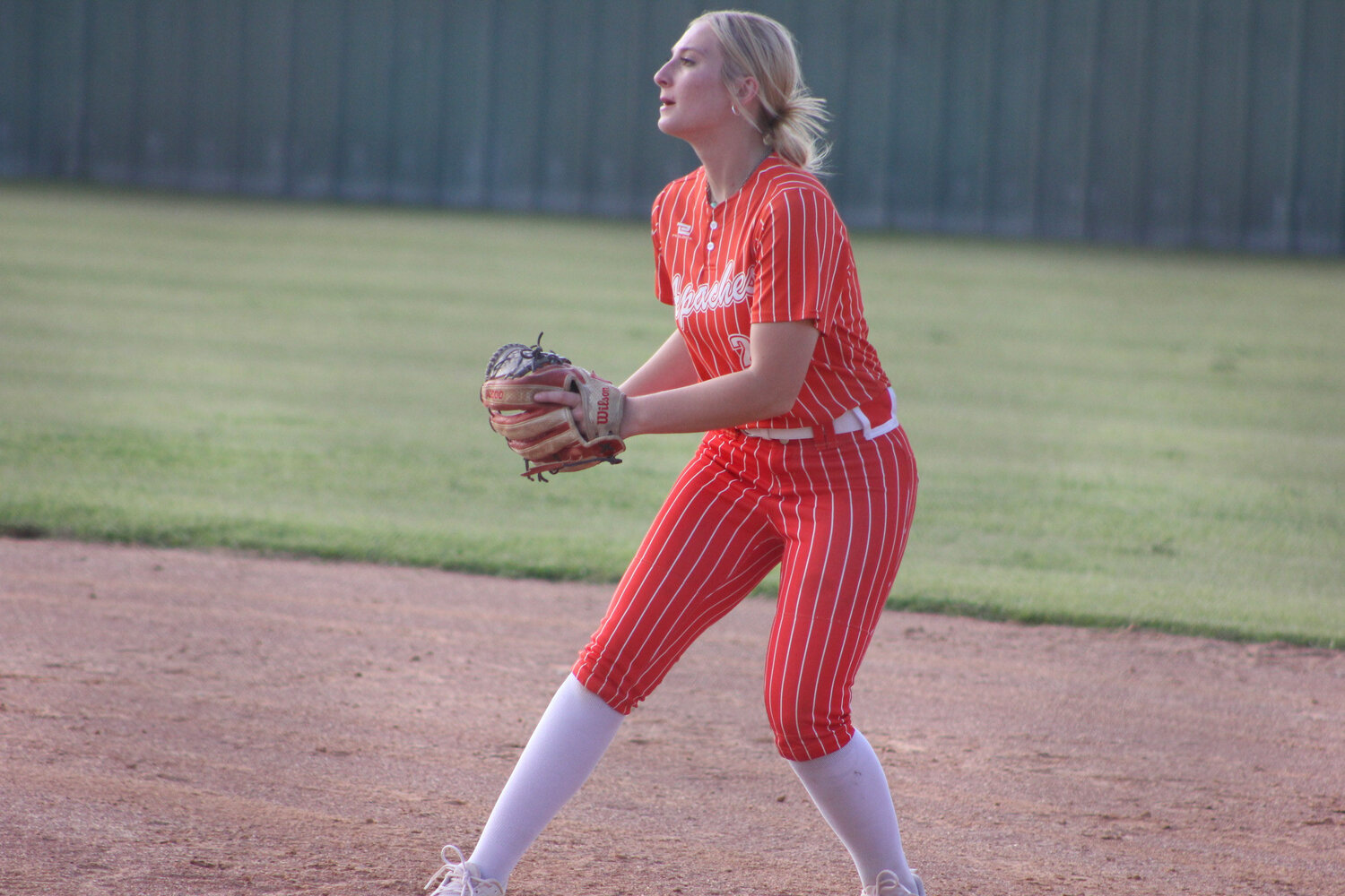 : Lady Apaches junior 
first baseman Peyton Springfield in 
a pre-playoff warmup match against 
Shiner St. Paul Monday, April 22.
