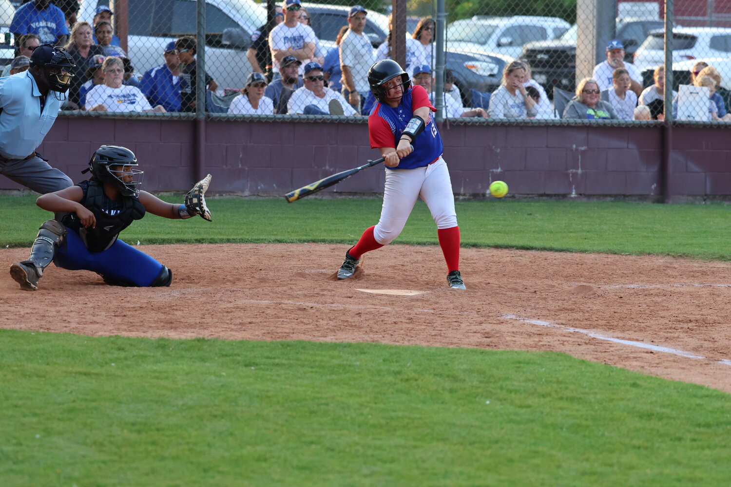 Lady Mustangs Kaelynn Mendiola (13) swings at a pitch in the bi-district match against Yoakum.