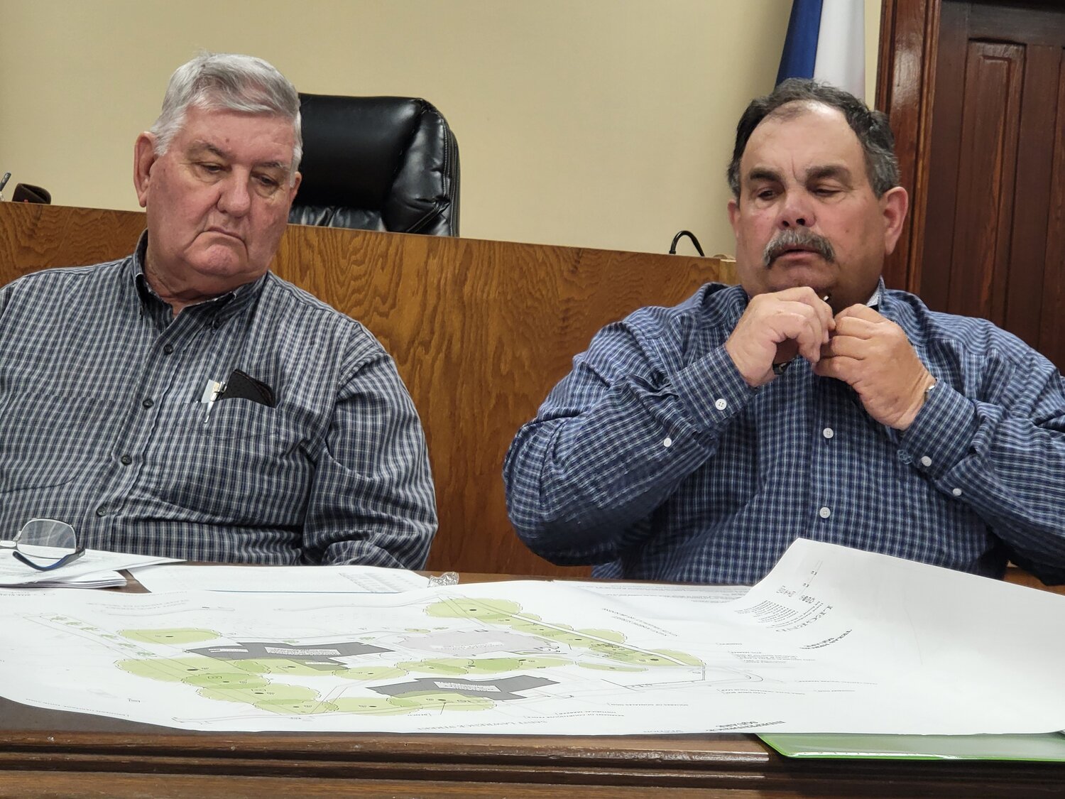 Gonzales County Precinct 2 Commissioner Donnie Brzozowski, left, and Precinct 3 Commissioner Kevin La Fleur study proposed changes to the Gonzales County Courthouse. The county has applied for a $10 million restoration grant for the Courthouse.