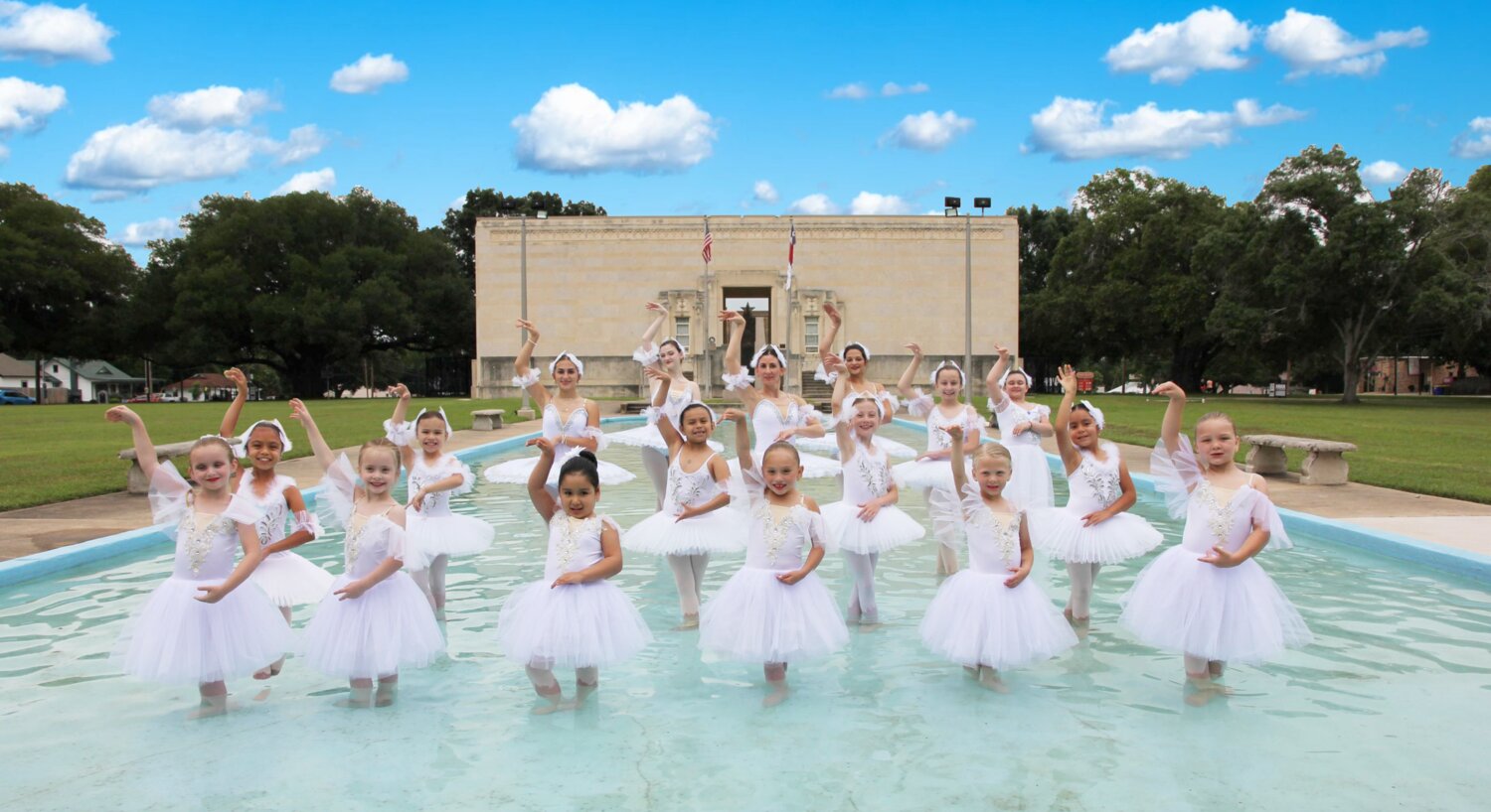 Seventeen swans a swimming! The beautiful Swan Lake swans have made a majestic stop at the reflection pool in front of Gonzales Memorial Museum, on their way to The Crystal Theatre! Don't miss the chance to experience the enchanting tale of "Swan Lake" live on June 8-9. Tickets are available at comeandtakeitdance.com.
