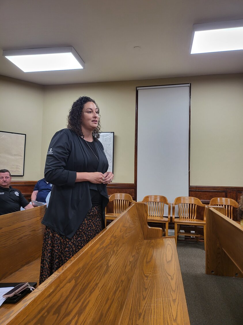 Anita Scoggins of Victoria Communication Systems (VCS) tells Gonzales County commissioners the emergency communications tower project should be rebid and that her company had properly filed a protest. VCS claims the county would not give enough time to properly draw up bid specifications after questions were raised and that the bid notice in the Inquirer contained incorrect information.