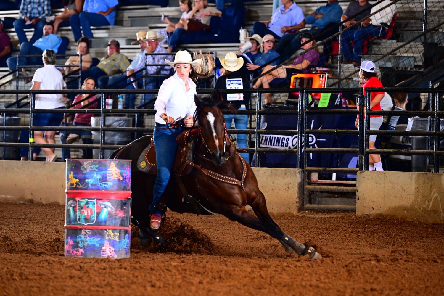 Addy Kardosz maneuvers around a barrel for the barrel competition of the Texas High School Rodeo.