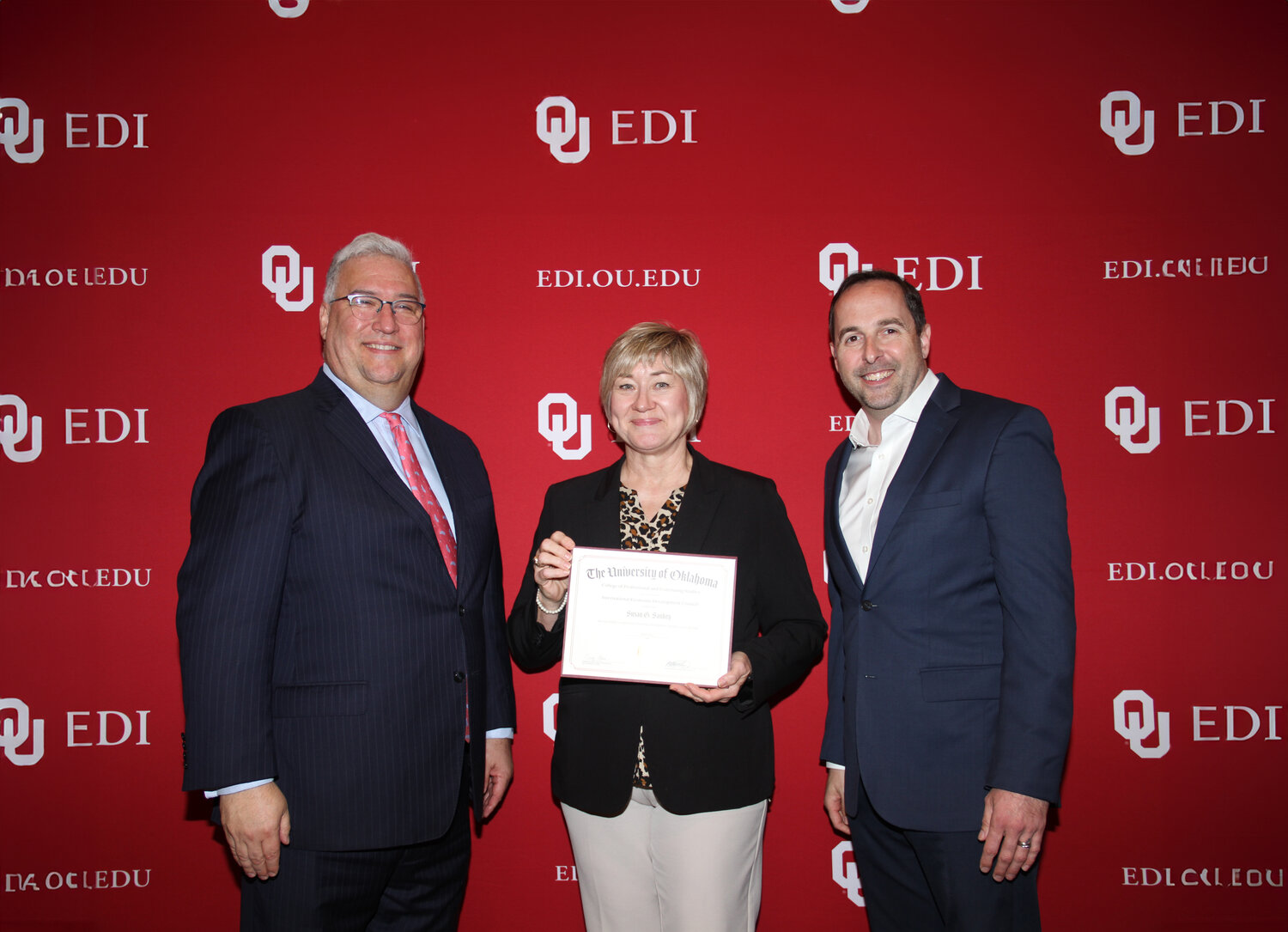 Susan Sankey, center, graduated from the University of Oklahoma Economic Development Institute (OU EDI) at the OU Spring session this year. She is the executive director of the Gonzales Economic Development Corporation.