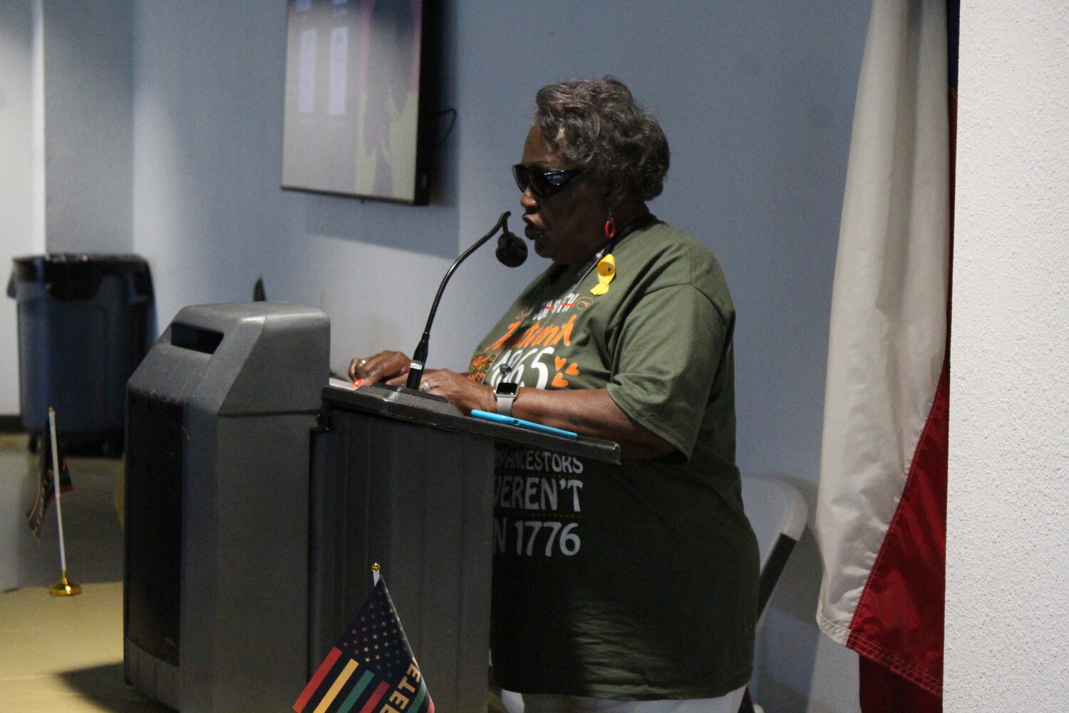 Rena White speaks at the podium and goes over the history of Juneteenth for the third annual celebration in Nixon Saturday, June 15.