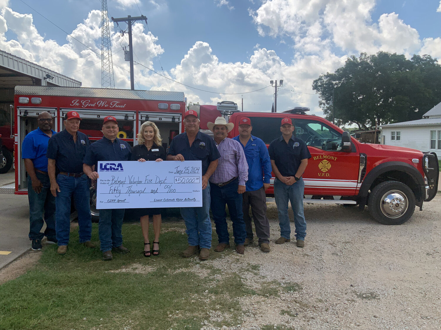 LCRA representatives present a $50,000 grant to the Belmont Volunteer Fire Department for a new mini pumper truck and vehicle extrication equipment. The grant is part of LCRA’s Community Development Partnership Program. Pictured, from left to right, are: Rick Arnic, LCRA Regional Affairs representative; Kenneth Schauer, Belmont VFD captain; Jay Tinsley, first assistant fire chief; Margaret D. “Meg” Voelter, LCRA Board member; Brian Schauer, fire chief; Kevin T. La Fleur, Gonzales County Commissioner, Precinct 3; and Austin McDonald and John DuBose III, firefighter.