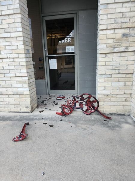 The damaged front door of the Gonzales Inquirer on Friday, July 19.