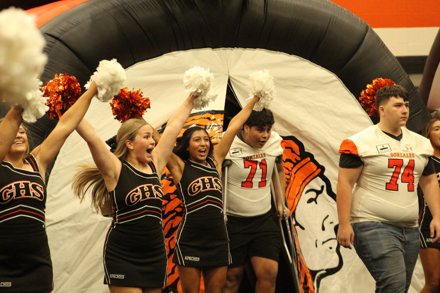 The Gonzales Apaches football teams walk out of the tunnel for the Meet the Apaches Friday, Aug. 9. Volleyball, tennis, cross-country, cheerleaders and the Apaches Flames were introduced at Meet the Apaches to kick off the 2024 Fall Sports season.