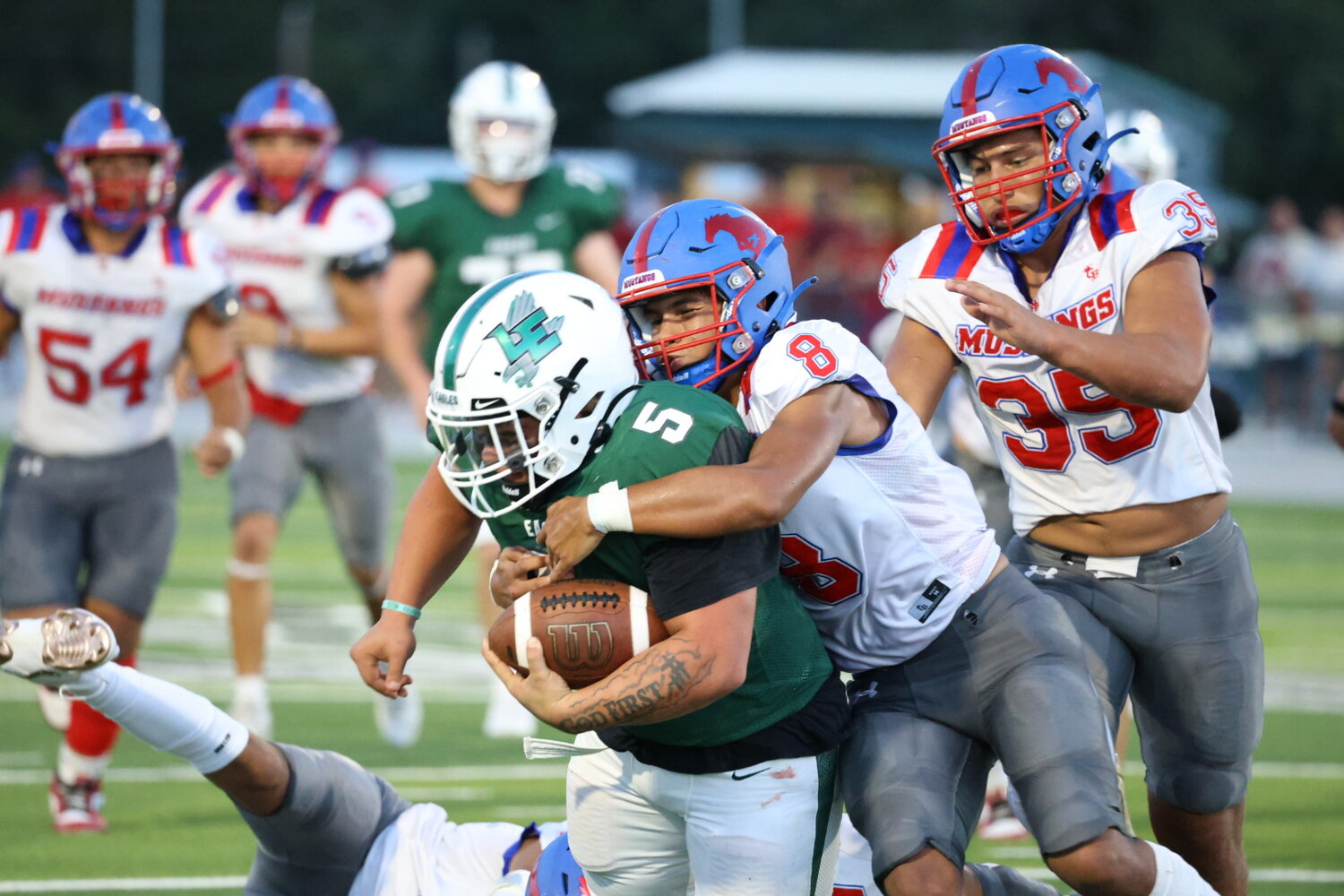 Mustangs senior linebacker Nick Martinez (8) tackles a Luling player in the season opener. The Mustangs will host the Three Rivers Bulldogs for the home opener Friday, Sept. 6.