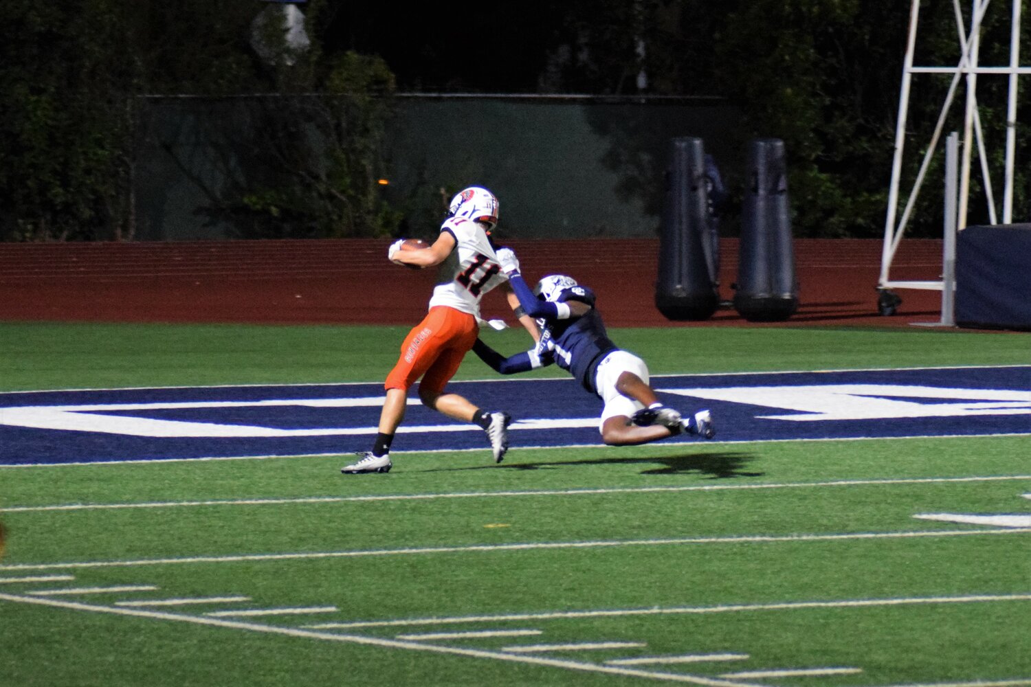 Apaches sophomore Brayden Hoffman (11) gets tackled near Central Catholic’s endzone. The Apaches will take on Hallettsville on the road Friday, Sept. 6.