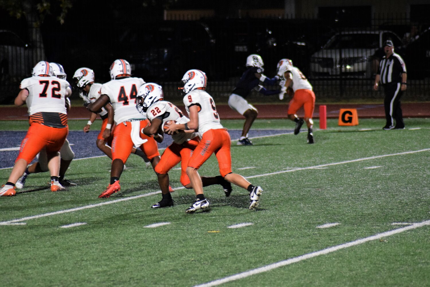 Gonzales freshman quarterback Tyler Hoffman (9) fakes a hand-off with freshman running back Ayden Ramirez (22) in the Central Catholic game.