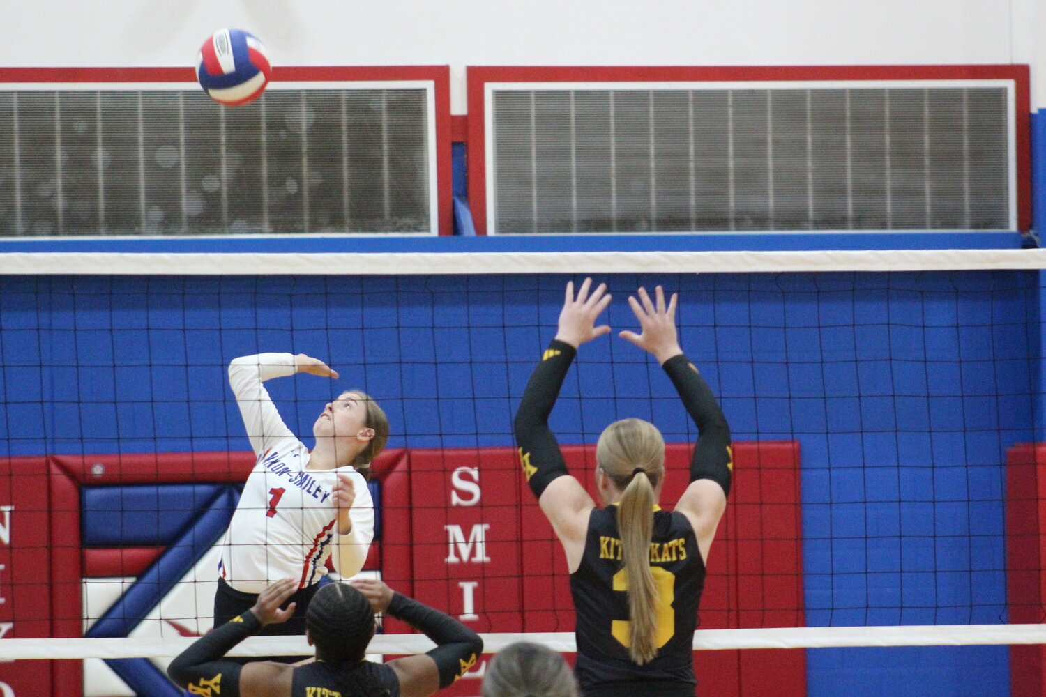 Lady Mustangs senior Brooke Crisp (1) jumps in the air to spike the ball against Yorktown Tuesday, Sept. 17.