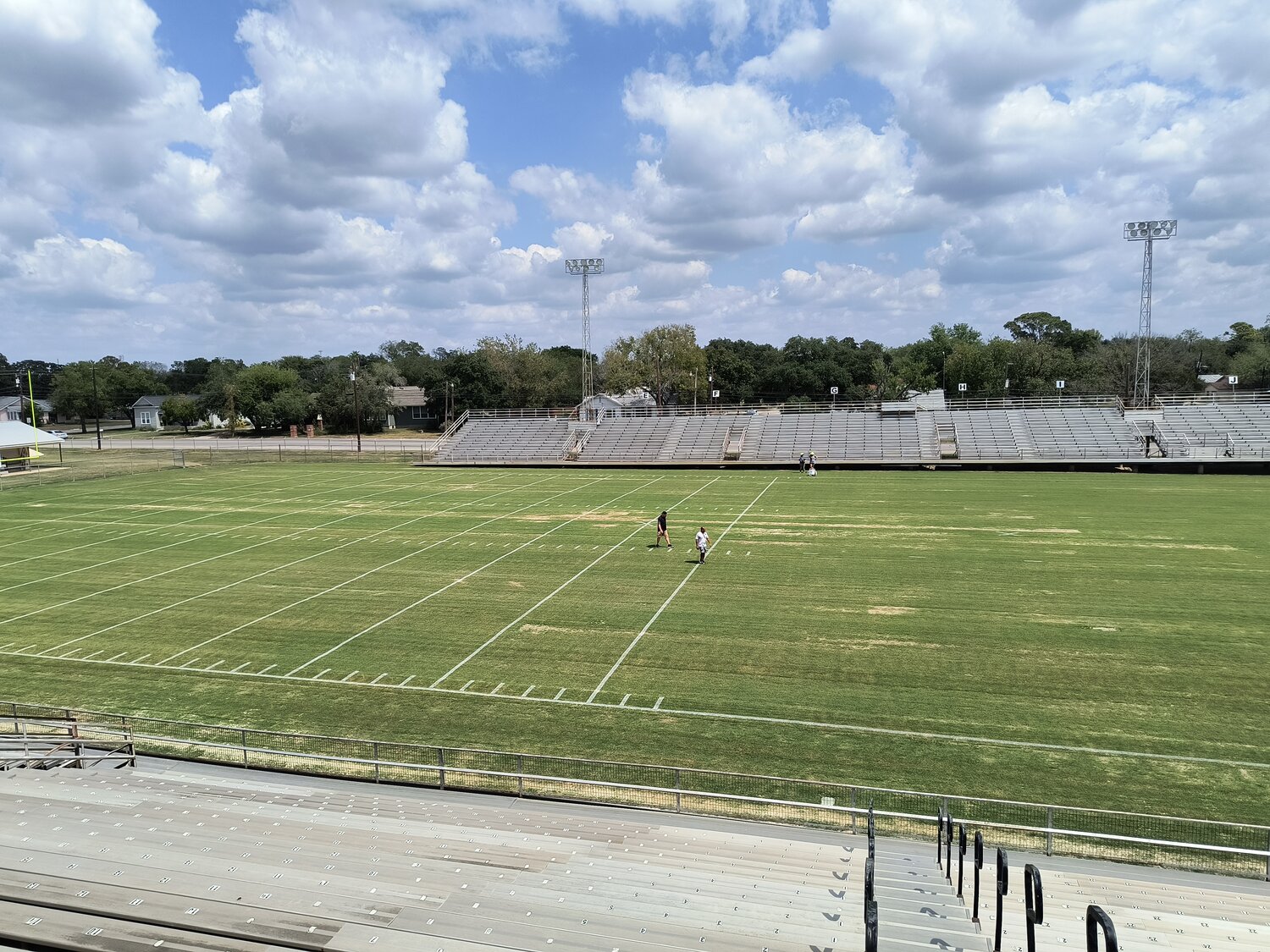 The Gonzales ISD maintenance crew adds the yard lines at Apache Field for the home opener against the Pleasanton Eagles Friday, Sept. 20.