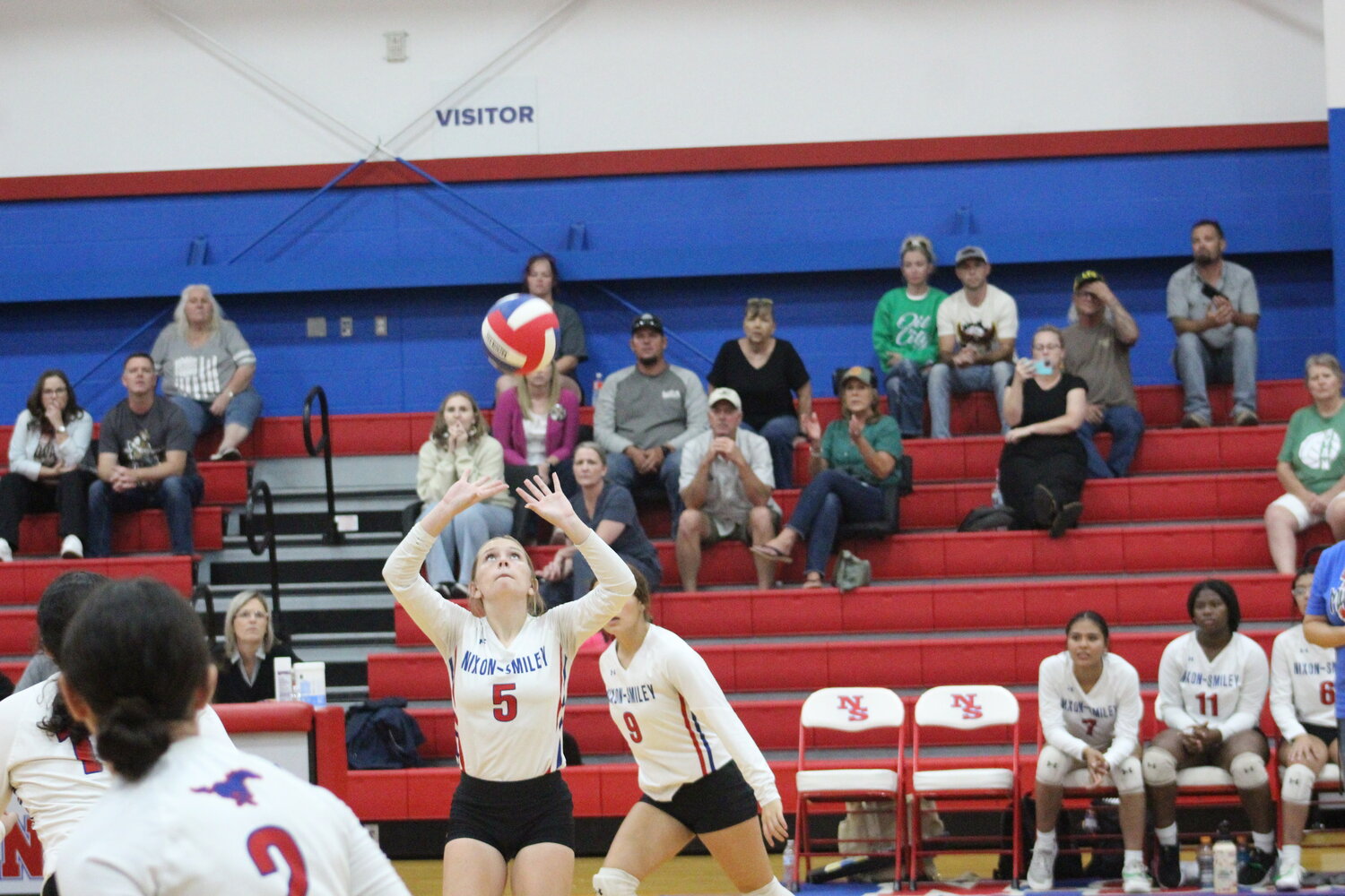 Nixon-Smiley junior Sadie Walden (5) sets up a play for the Lady Mustangs in the district match against Luling Tuesday, Oct. 1.