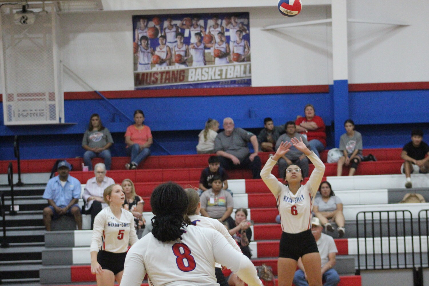 Lady Mustangs sophomore Lee-Nuh Pecina (6) sets up a play for the offense in the district match against the Karnes City Lady Badgers Tuesday, Oct. 8.