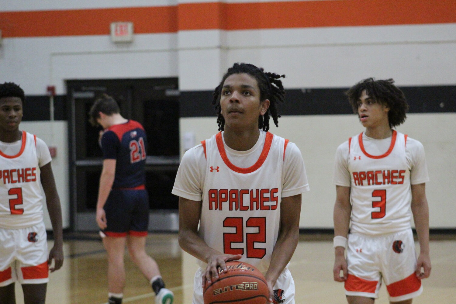 Apaches junior forward Bill Greathouse (22) shoot two free throws against the Wimberley Texans Tuesday, Dec. 3.