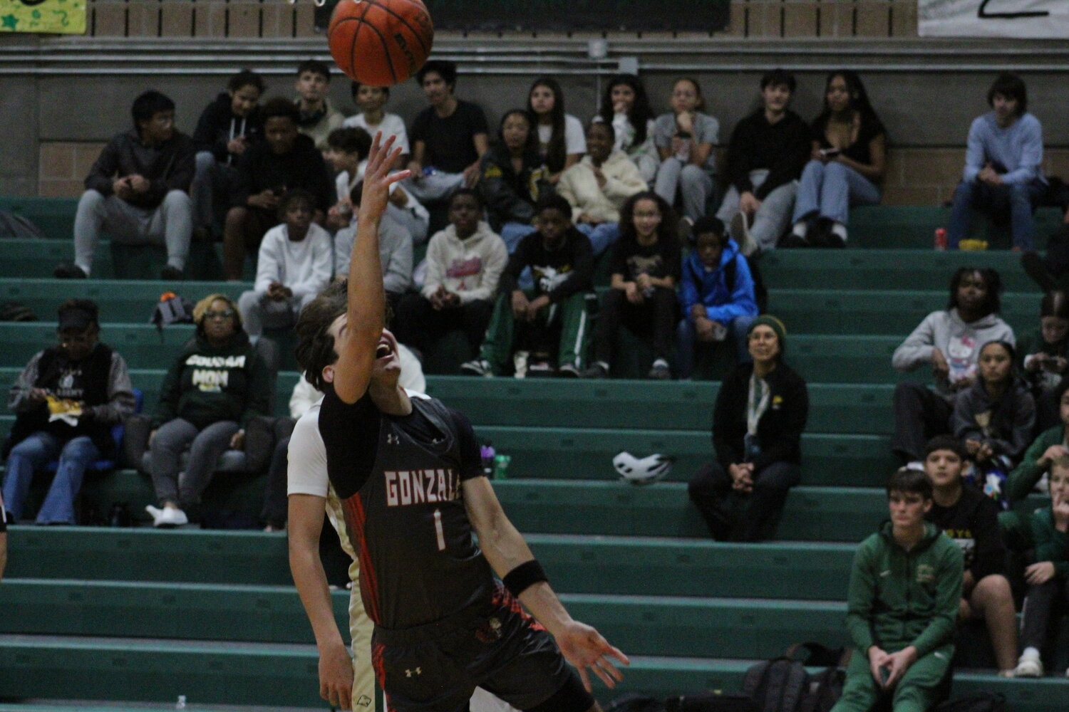 Apaches senior forward Gavin Lekgega (1) shoots a layup shot for Gonzales in the game against the Cole Cougars.