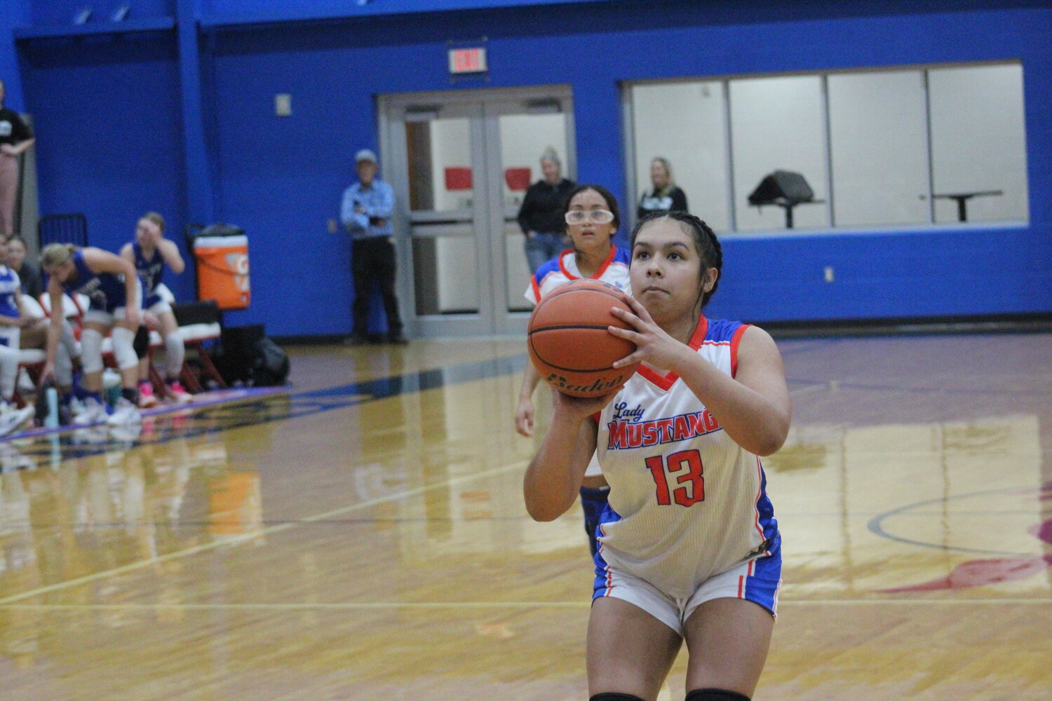 Lady Mustangs Ashly Garcia (13) shoots two free throws against Falls City early this season.