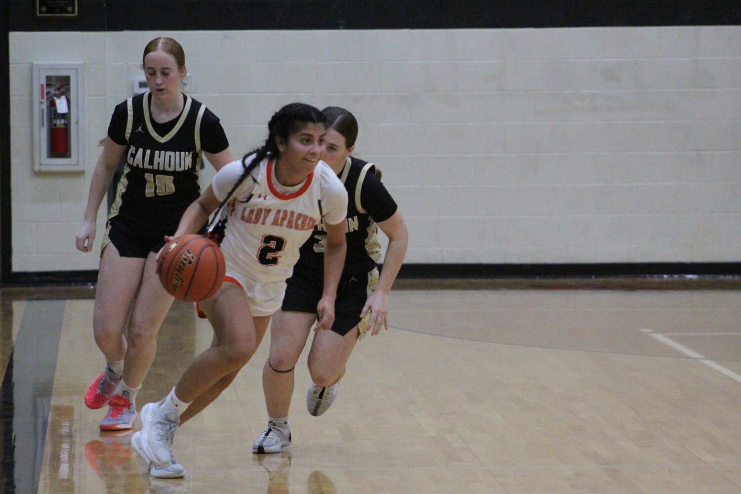 Lady Apaches senior Bella Aguero moves the ball down court against the Calhoun Sandies Tuesday, Dec. 17 at home.