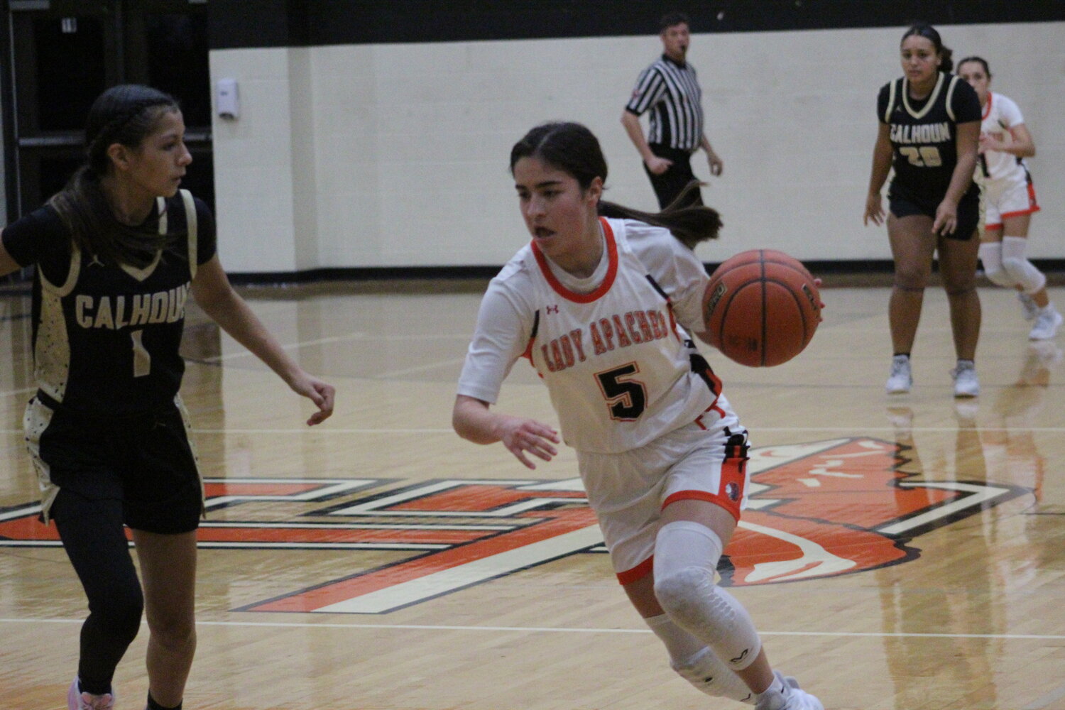 Senior Kilee Schwausch dribbles the ball past a Calhoun defender Tuesday, Dec. 17.