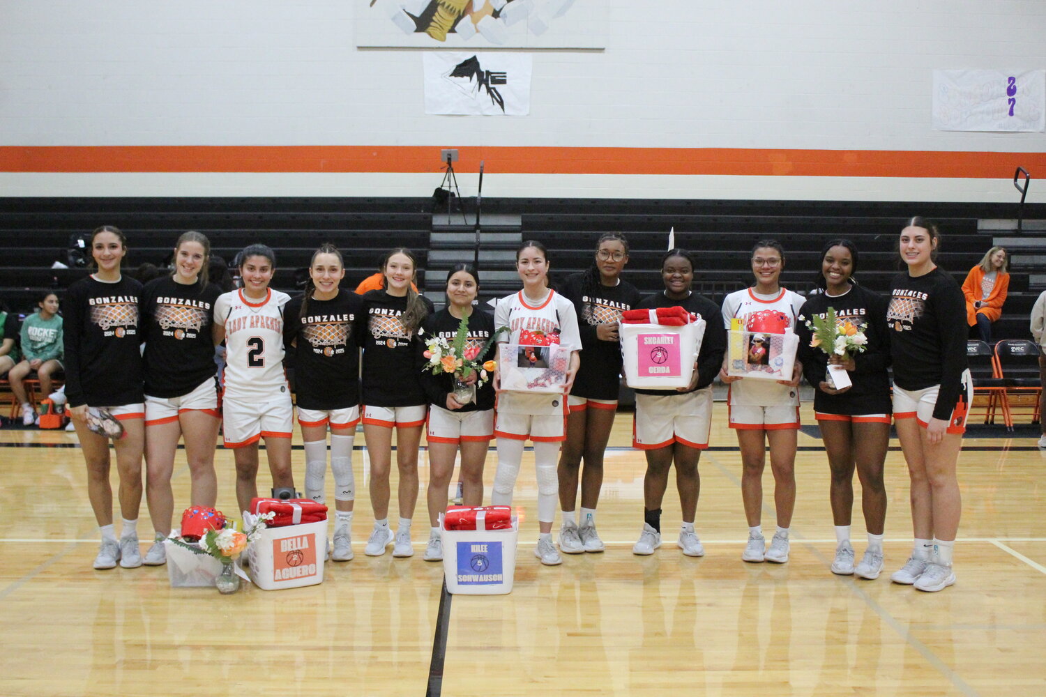 The Lady Apaches celebrate and say goodbye to their three seniors on the team Bella Aguero (2), Kilee Schwausch (5) and Skcarlett Cerda (3) in the final home game of the season.